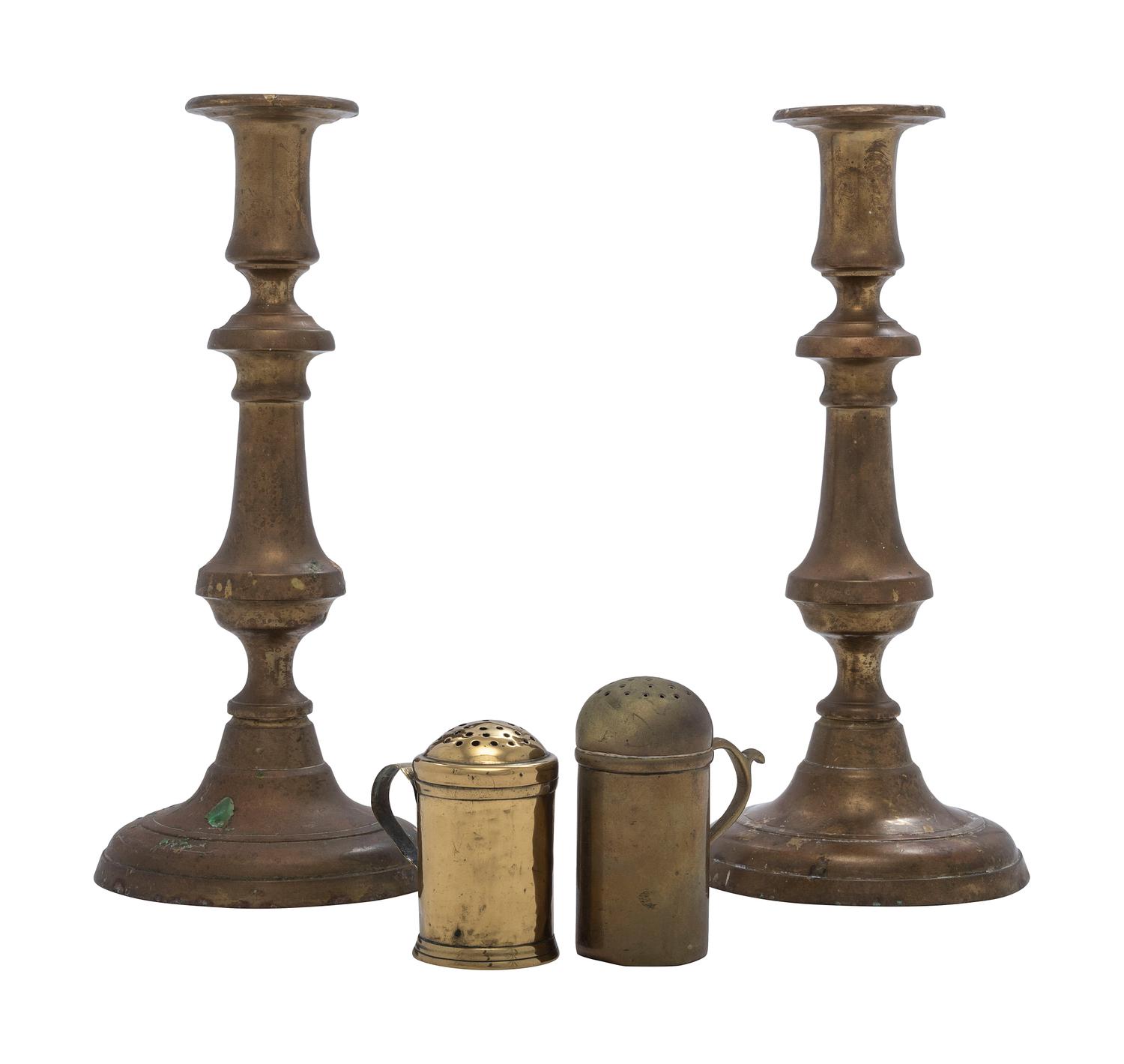 A Pair of Brass Candlesticks and Two Brass Shakers