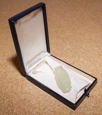 A Celadon Jade Bird Pendant. Length 1 7/8 inches.