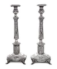 A Pair of Polish Silver Candlesticks, Izrael Shekman, Warsaw, Early 20th Century, each of square columnar form.