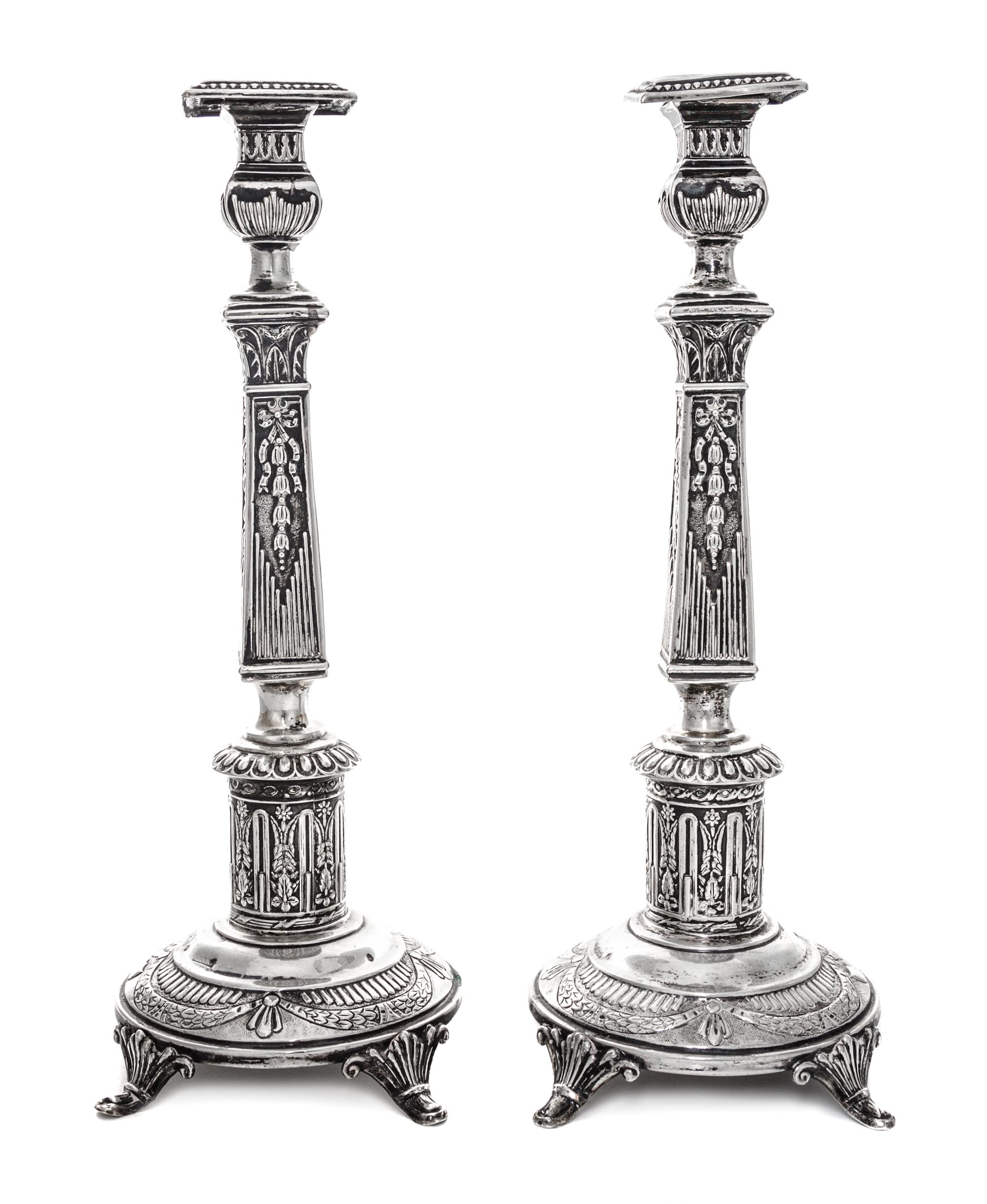 A Pair of Polish Silver Candlesticks, Izrael Shekman, Warsaw, Early 20th Century, each of square columnar form.