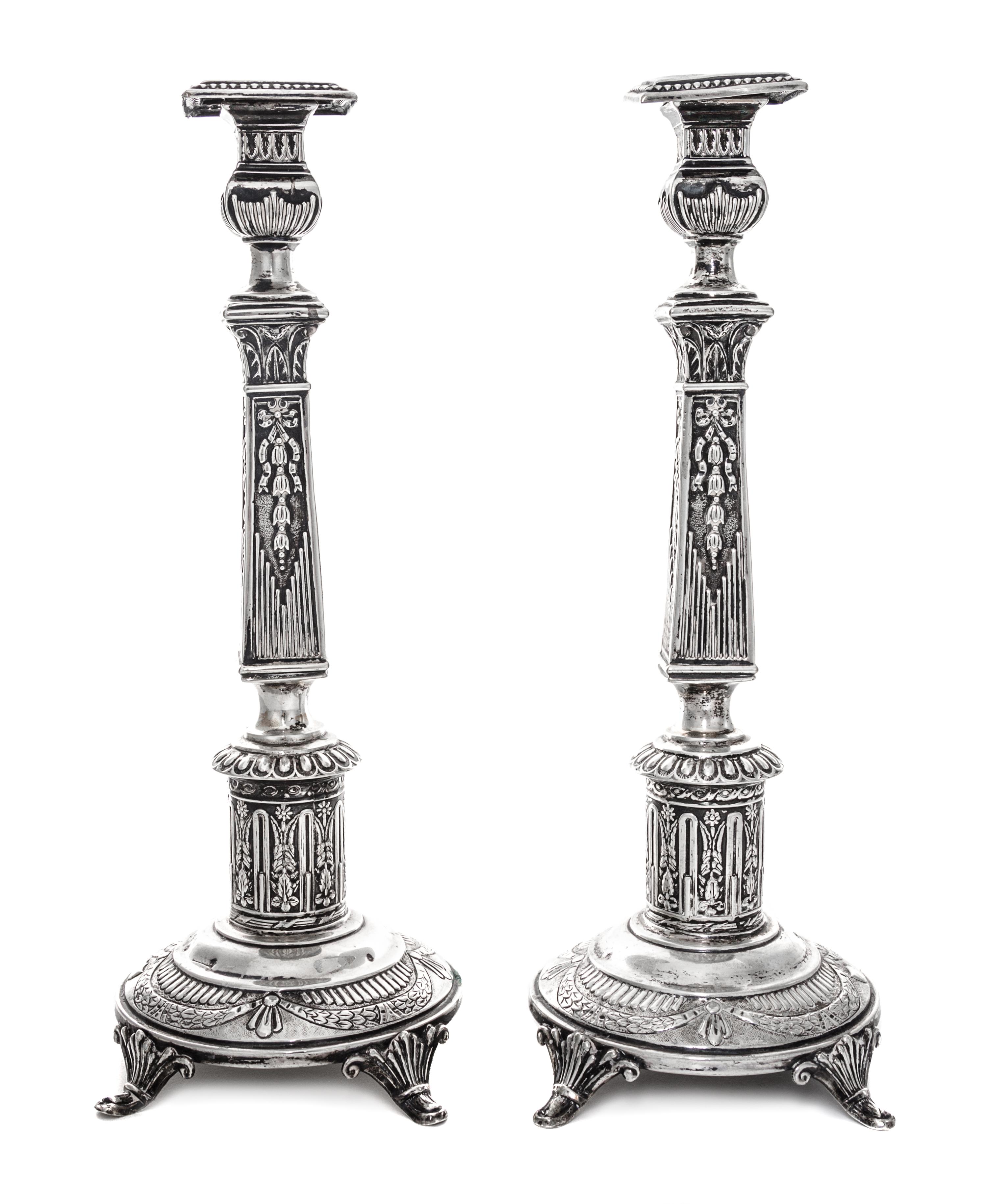 A Pair of Polish Silver Candlesticks, Izrael Shekman, Warsaw, Early 20th Century, each of square columnar form.