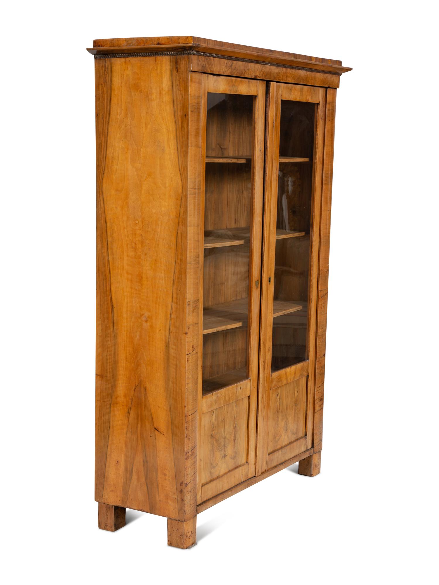 A Pair of Biedermeier Figured Birch Bookcases