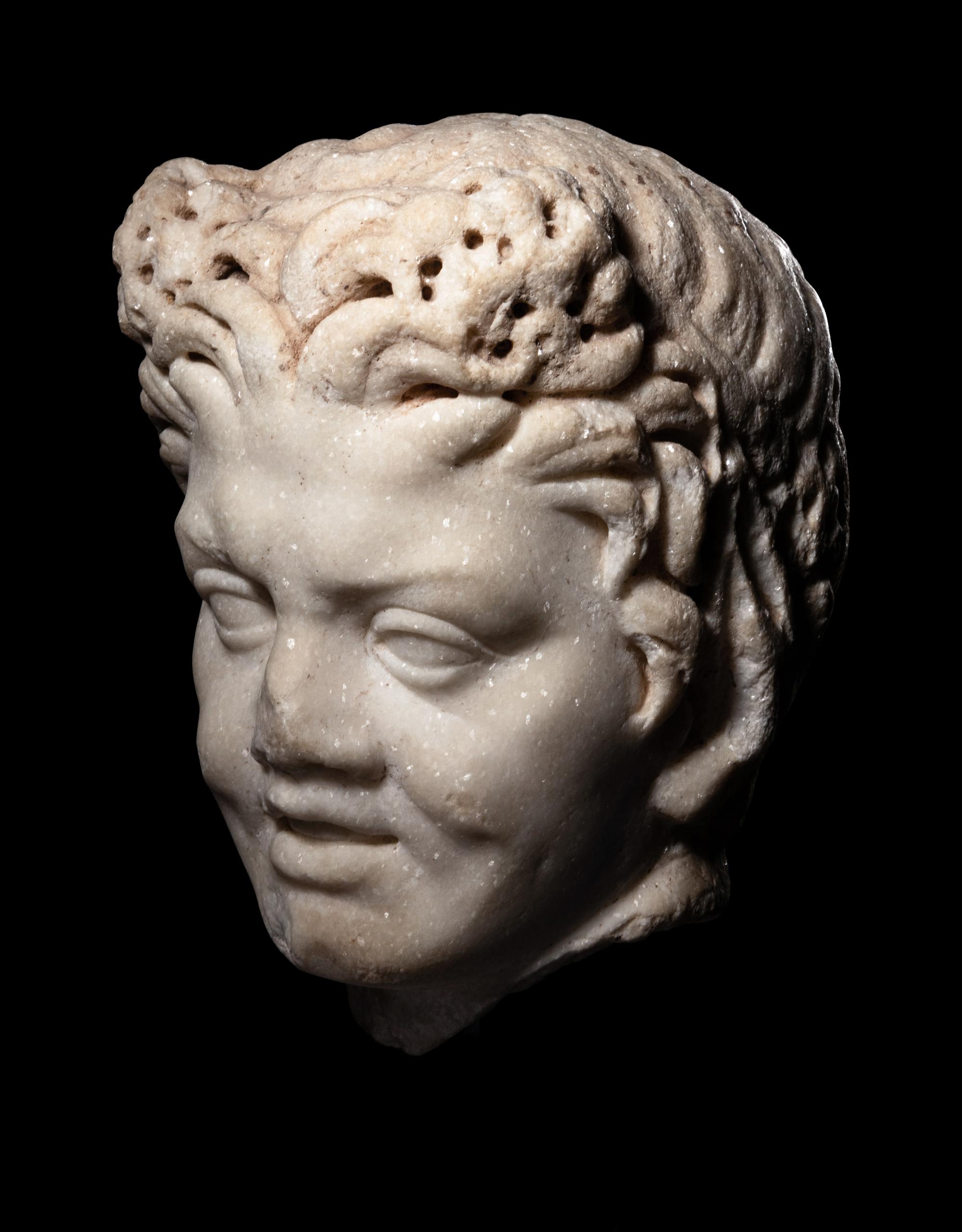 A Roman Marble Satyr Head