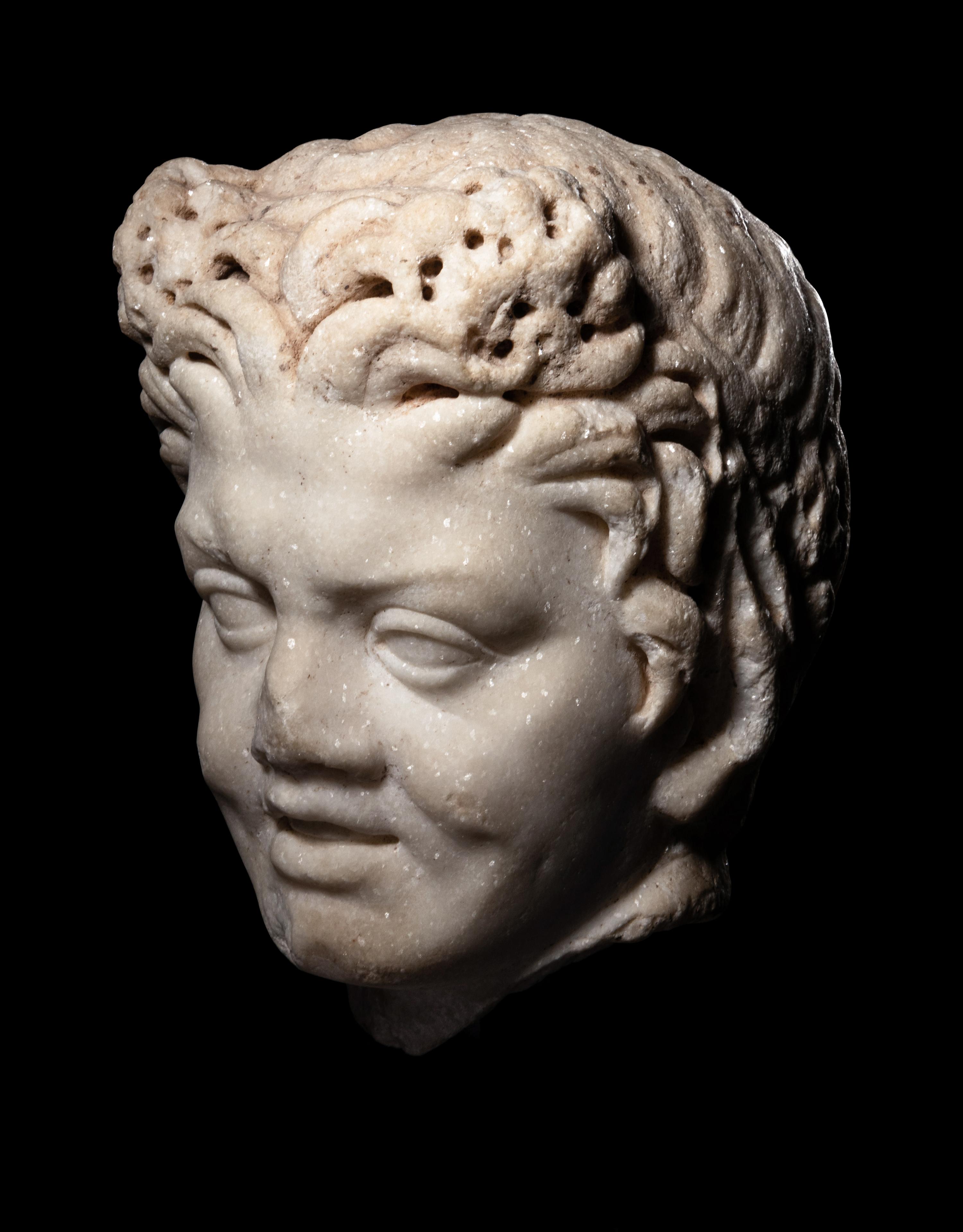 A Roman Marble Satyr Head