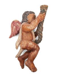 A Spanish Colonial Carved and Polychromed Putto Candlestick