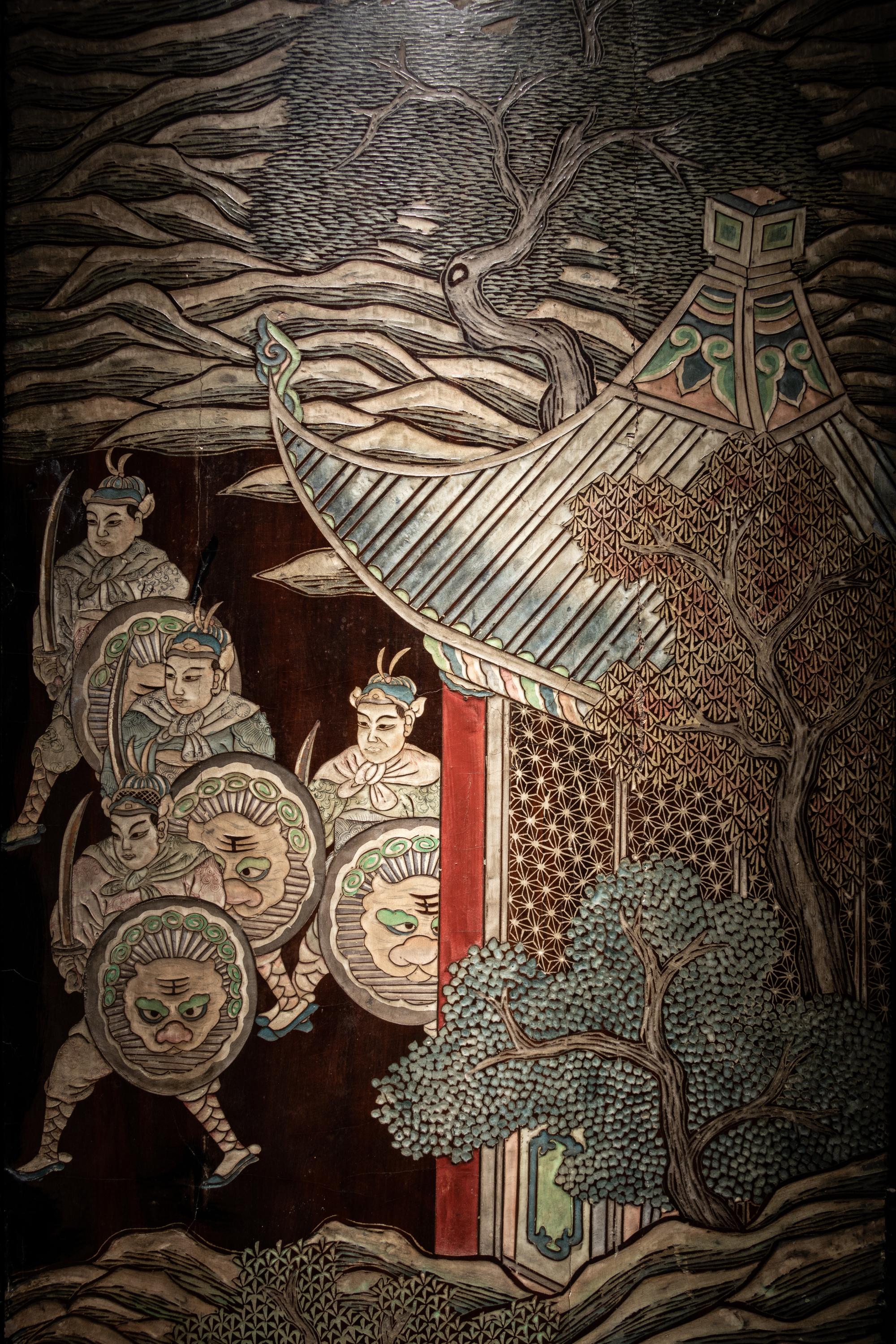 A Coromandel Lacquer Eight-Panel Floor Screen