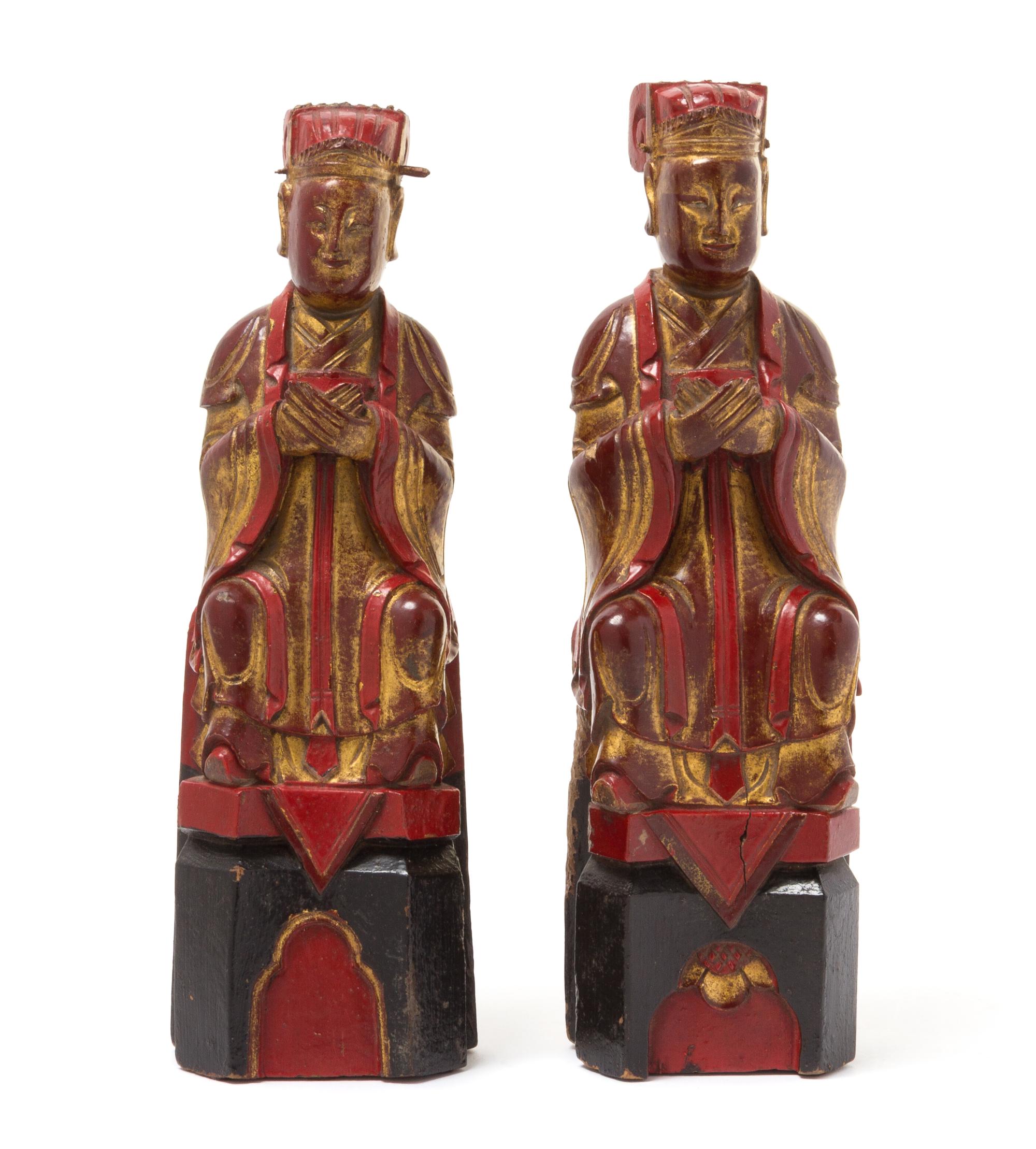 A Matched Pair of Gilt, Red and Black Lacquered Wood Figures of Scholars Height 11 7/8 inches.