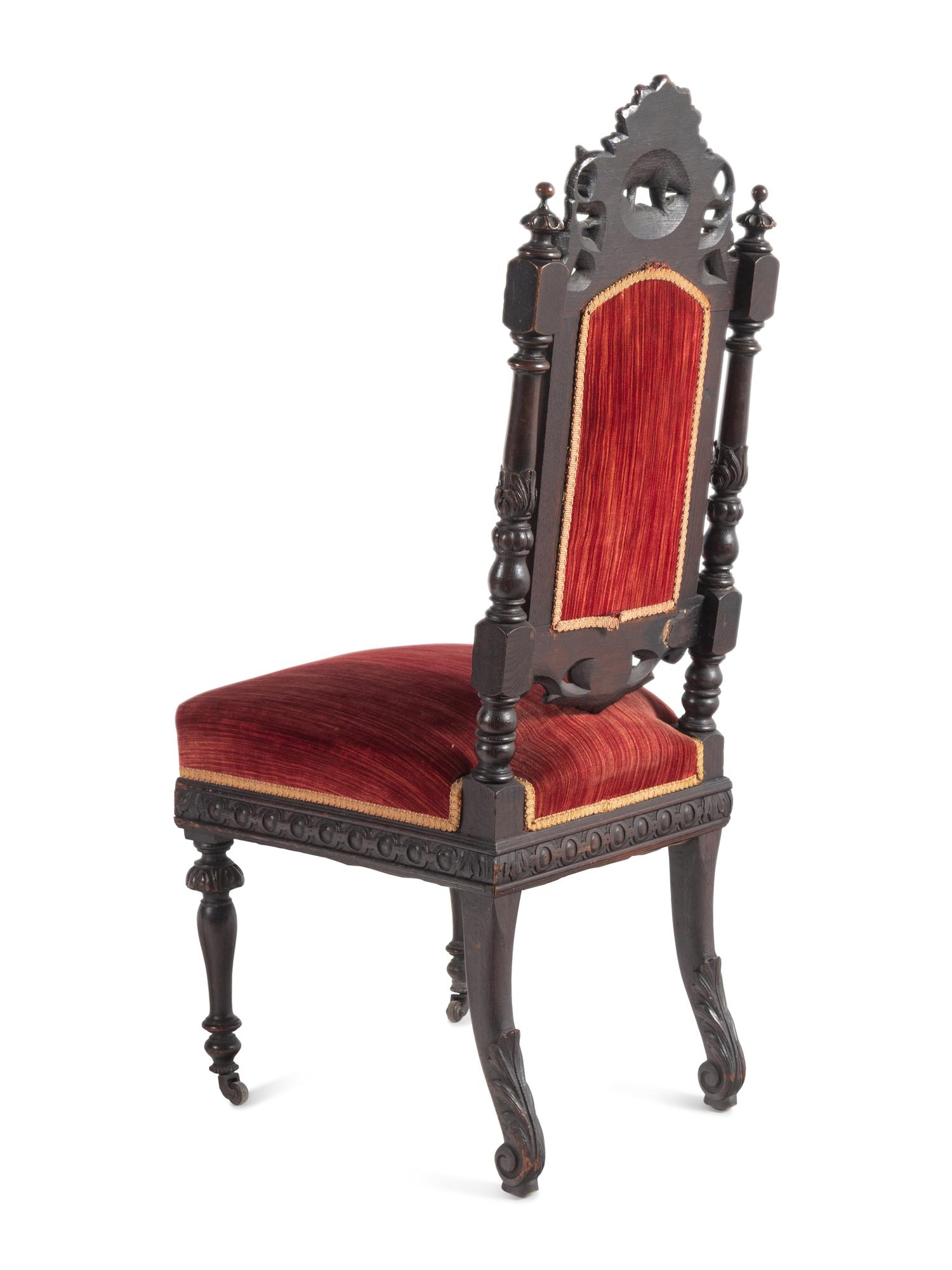 A Set of Ten Renaissance Revival Oak Dining Chairs
