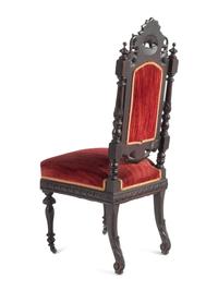 A Set of Ten Renaissance Revival Oak Dining Chairs