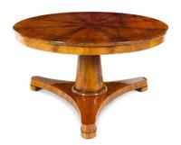 A Biedermeier Mahogany Center Table Height 29 x diameter of top 52 3/4 inches. — SECOND QUARTER 19TH CENTURY