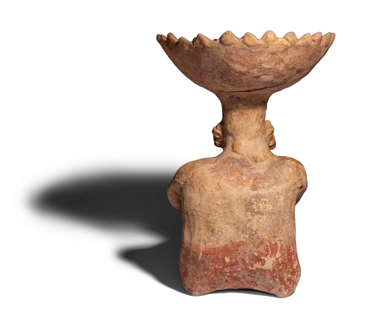 A Colima Terracotta Seated Figure with Bowl Head
