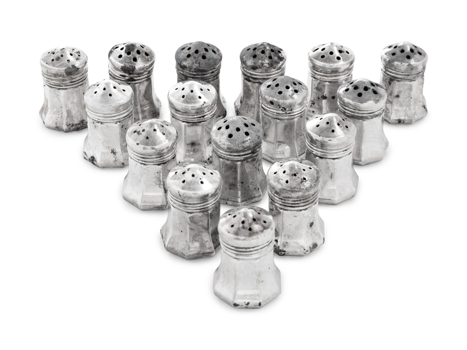 A Set of Sixteen Cartier Silver Casters