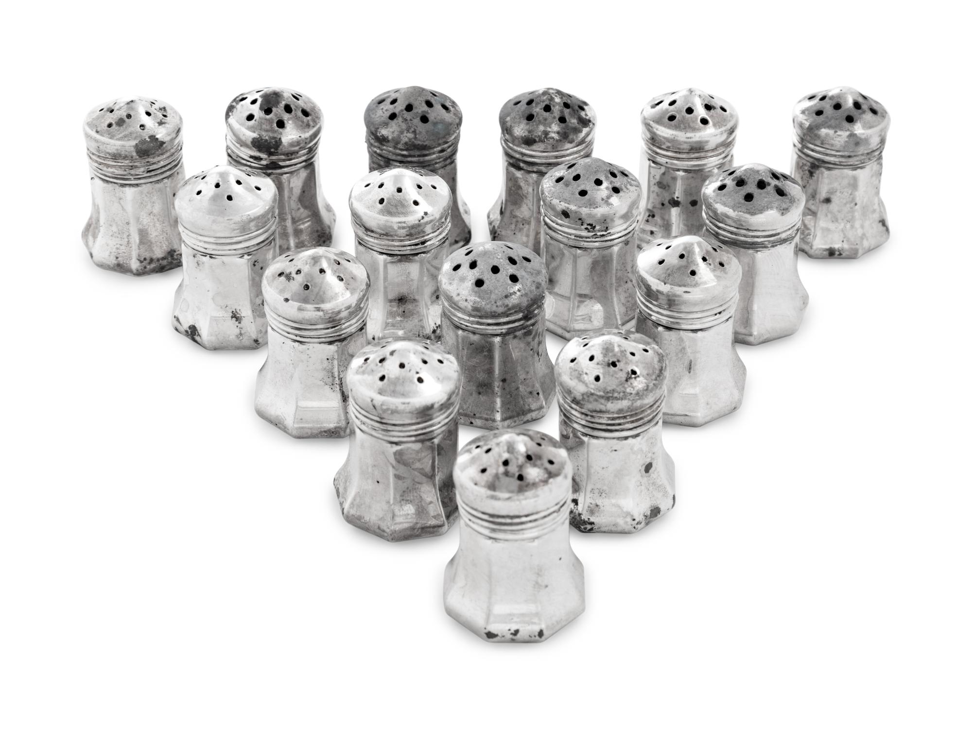 A Set of Sixteen Cartier Silver Casters