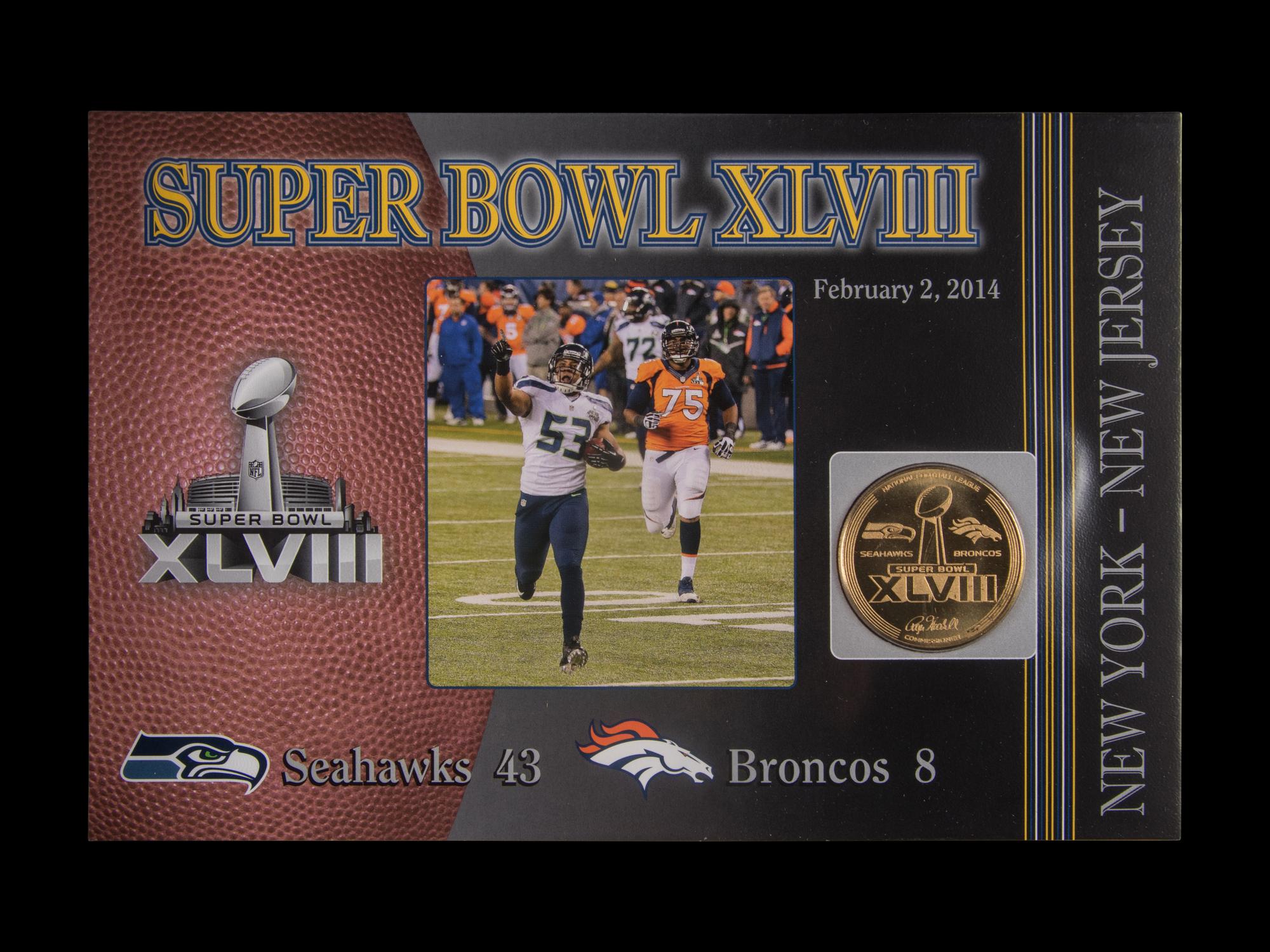 A Danbury Mint Super Bowl NFL Flip Coin Collection Book