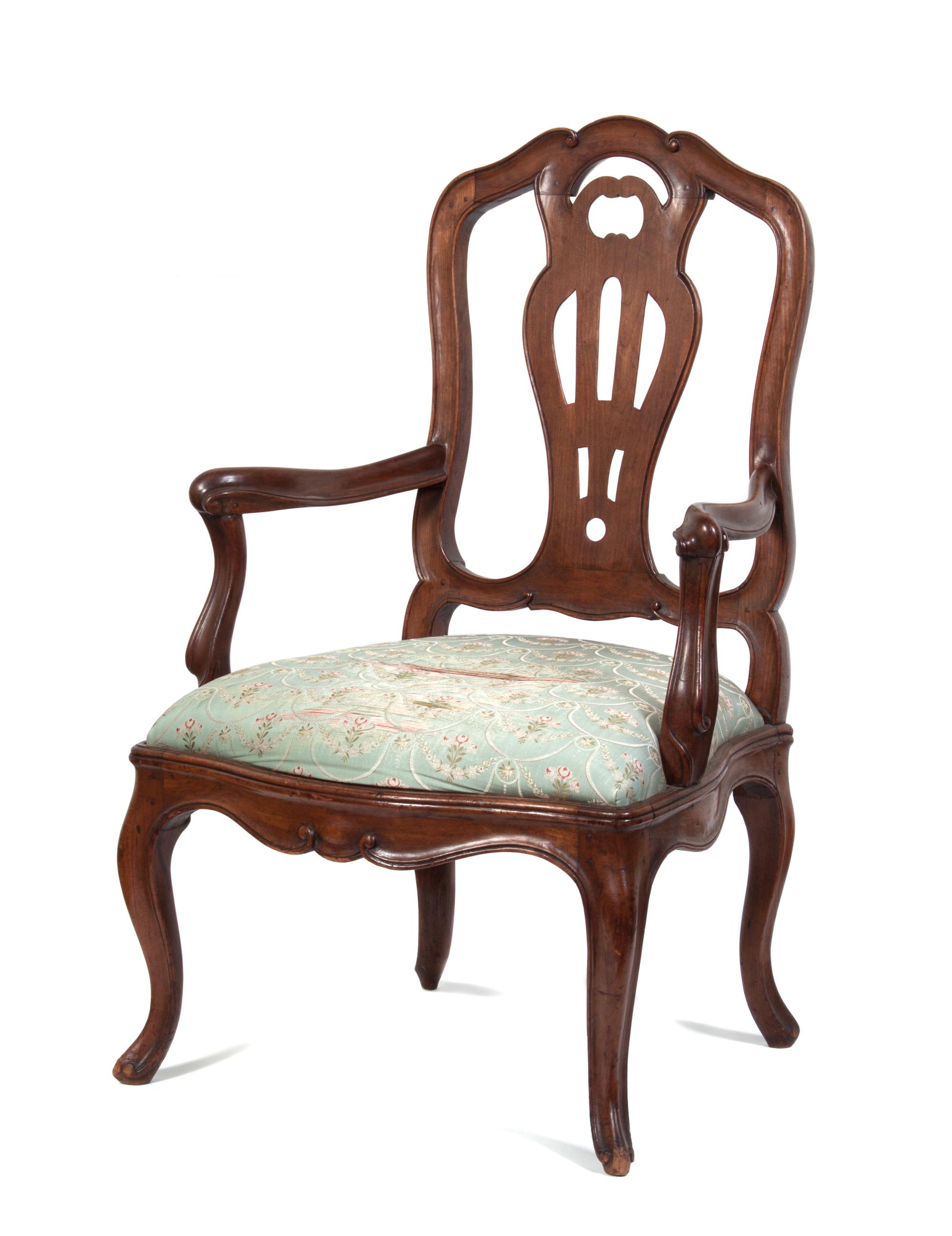 An Italian Walnut Armchair Height 41 3/4 inches.