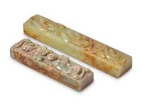 Two Chinese Carved Celadon and Russet Jade Scroll Weights