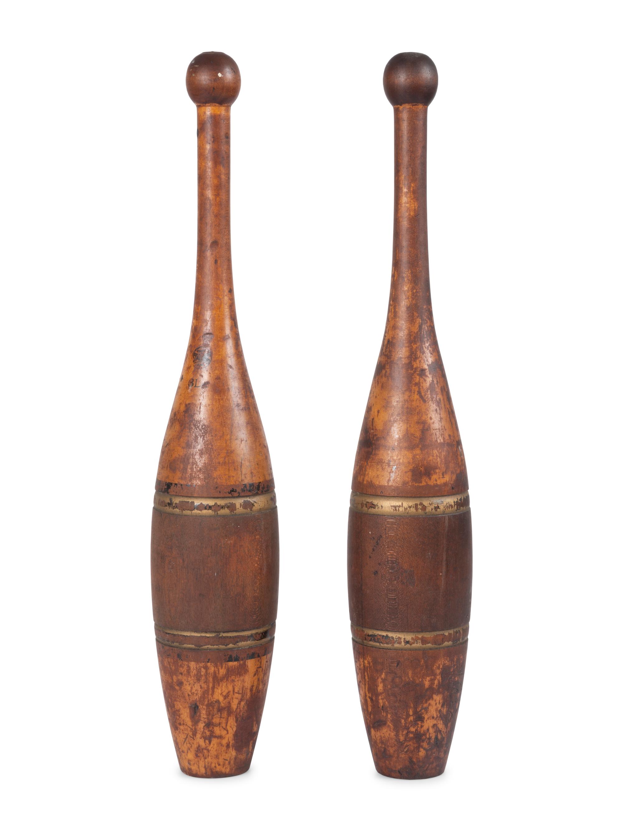 A Pair of Spalding 3Lb. Turned and Parcel Gilt Cherrywood Juggler's Pins