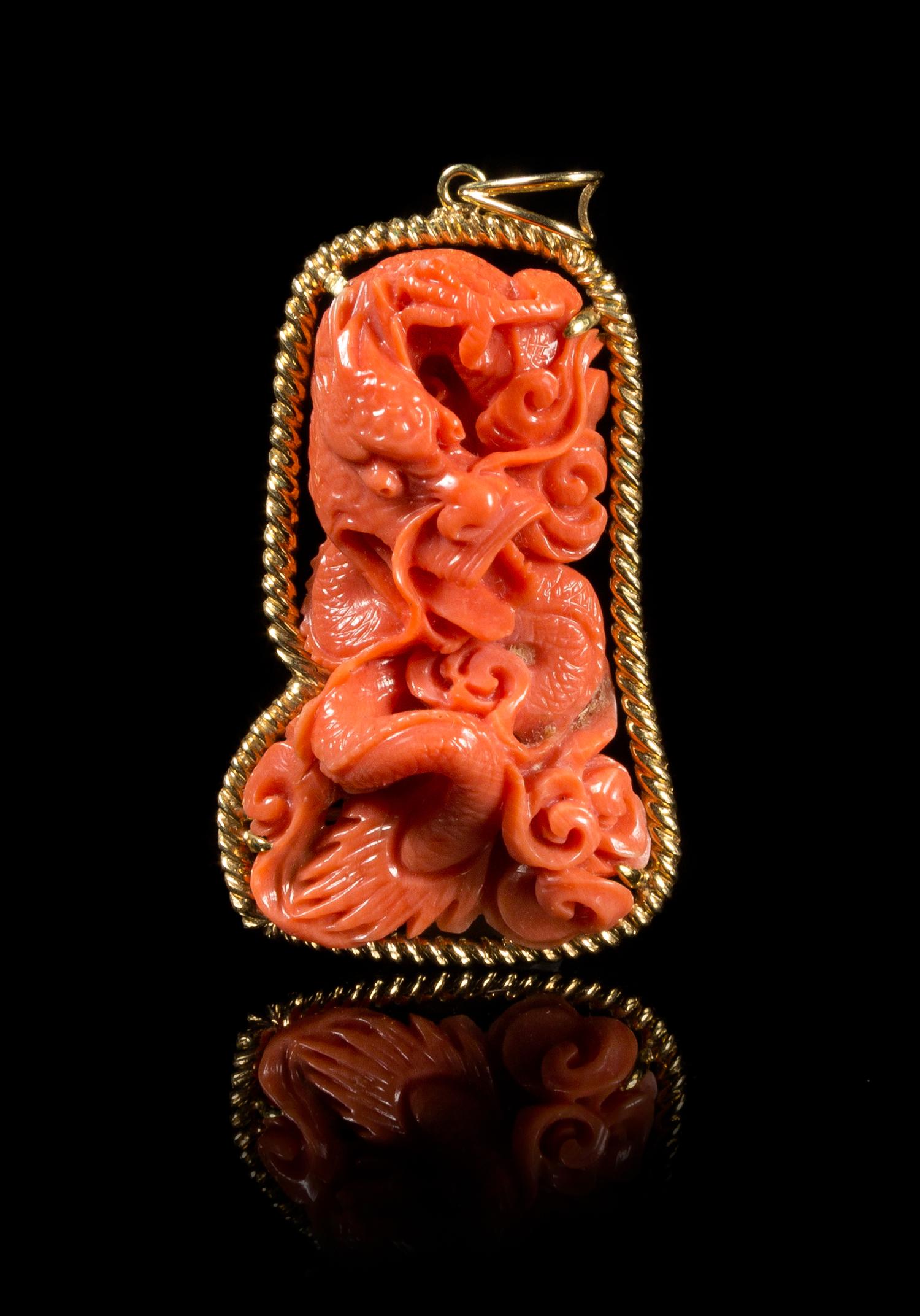 A Carved Coral Pendant Height 2 inches.