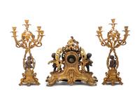 A Louis XV Style Gilt and Patinated Bronze Clock Garniture