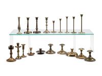 A Collection of Nineteen Brass Candlesticks