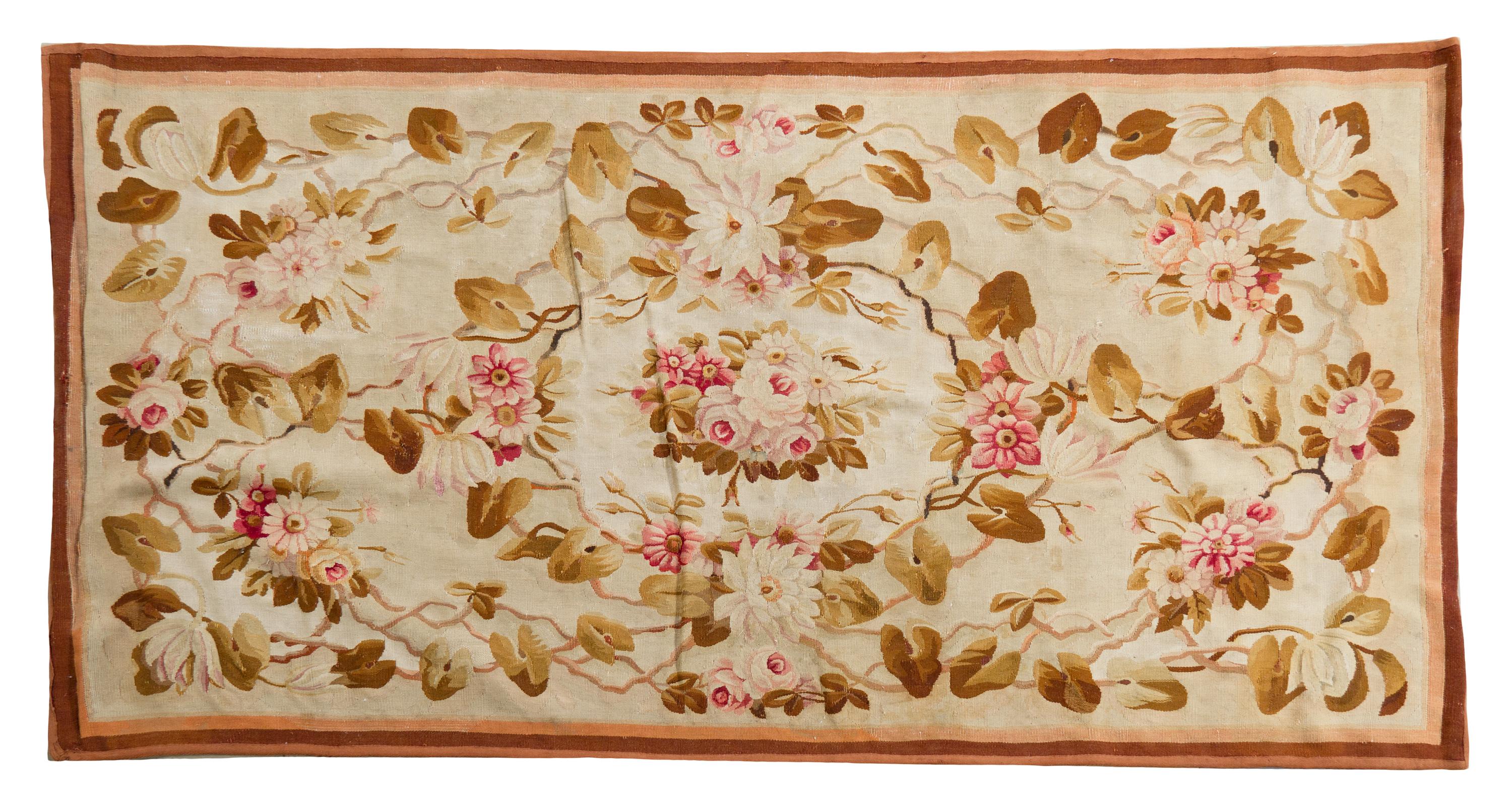 An Aubusson Wool Rug, 6 feet 9 1/2 inches x 3 feet 3 3/4 inches.