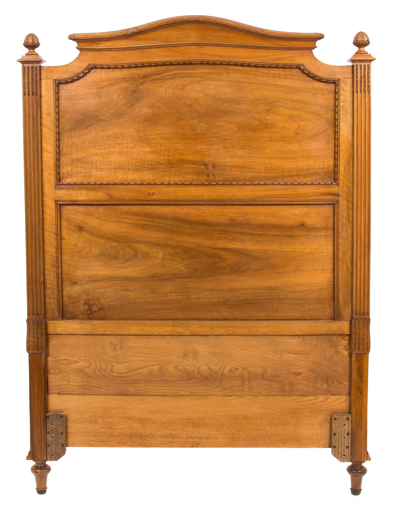 A Pair of Louis XVI Style Carved Walnut Twin Beds Height of headboard 58 inches x width 43 1/2 inches. — 19TH CENTURY