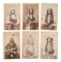 MITCHELL, Daniel S. (1838-1929), photographer. A group of 24 CDVs of Sioux chiefs and warriors at Red Cloud Agency. Cheyenne, WY, ca 1877.