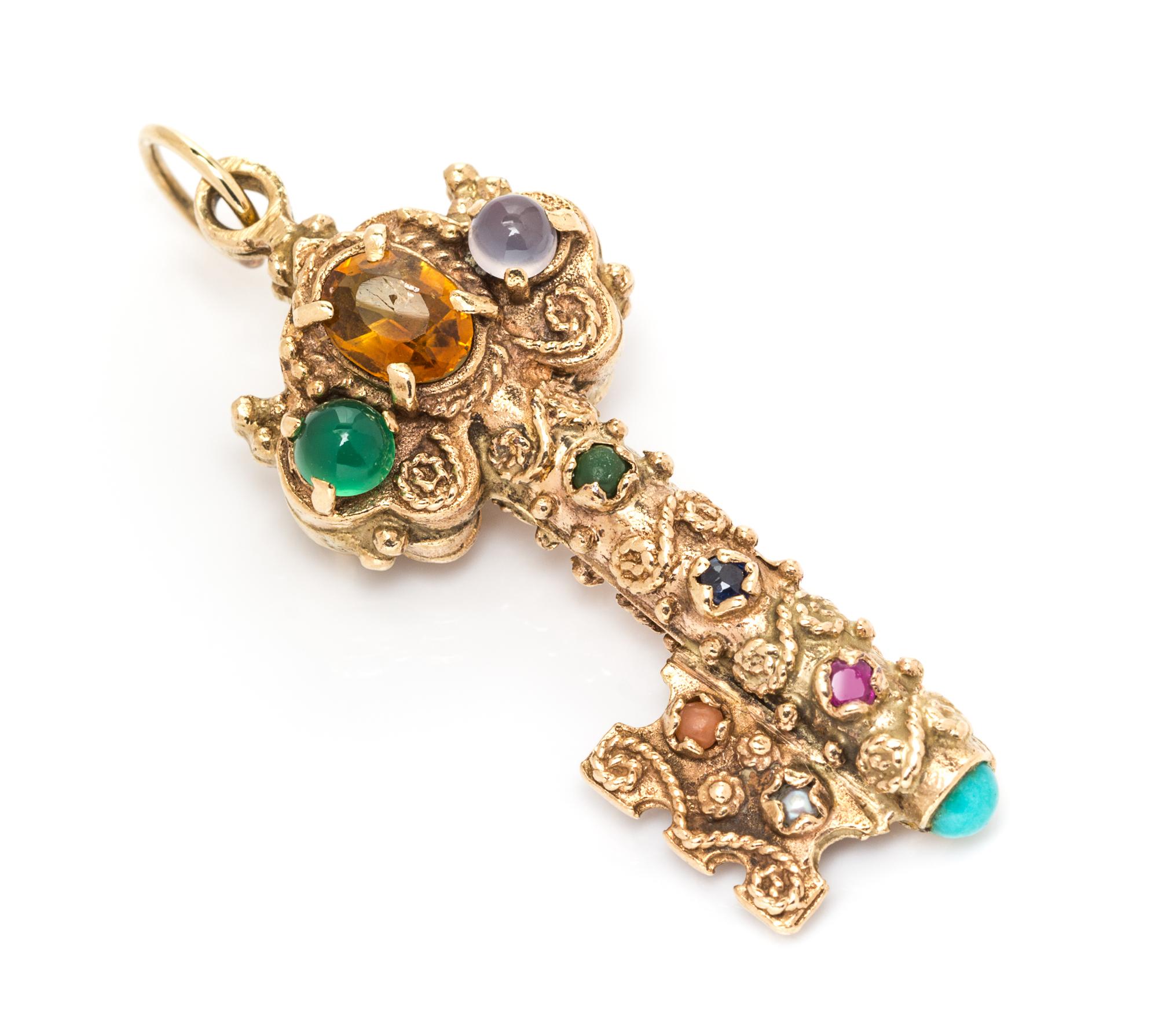 A Yellow Gold and Multigem Key Motif Pendant, 4.30 dwts.