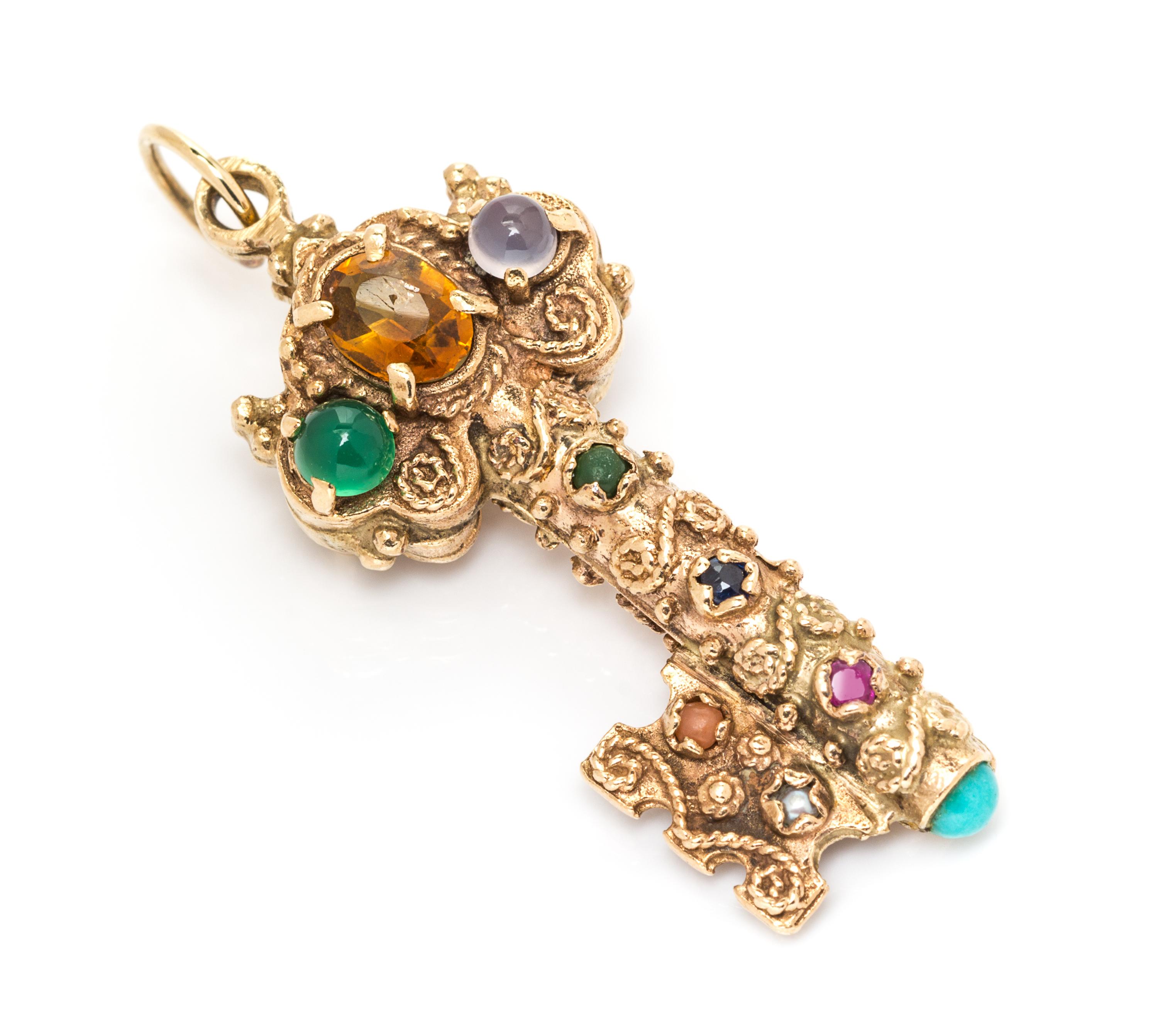 A Yellow Gold and Multigem Key Motif Pendant, 4.30 dwts.