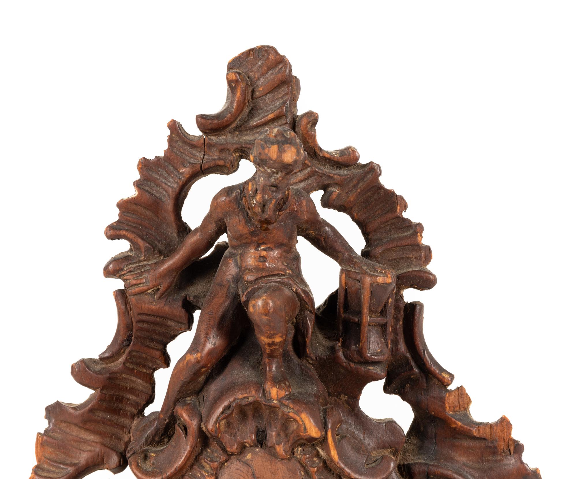 A Continental Rococo Style Carved Fruitwood Watch Stand
