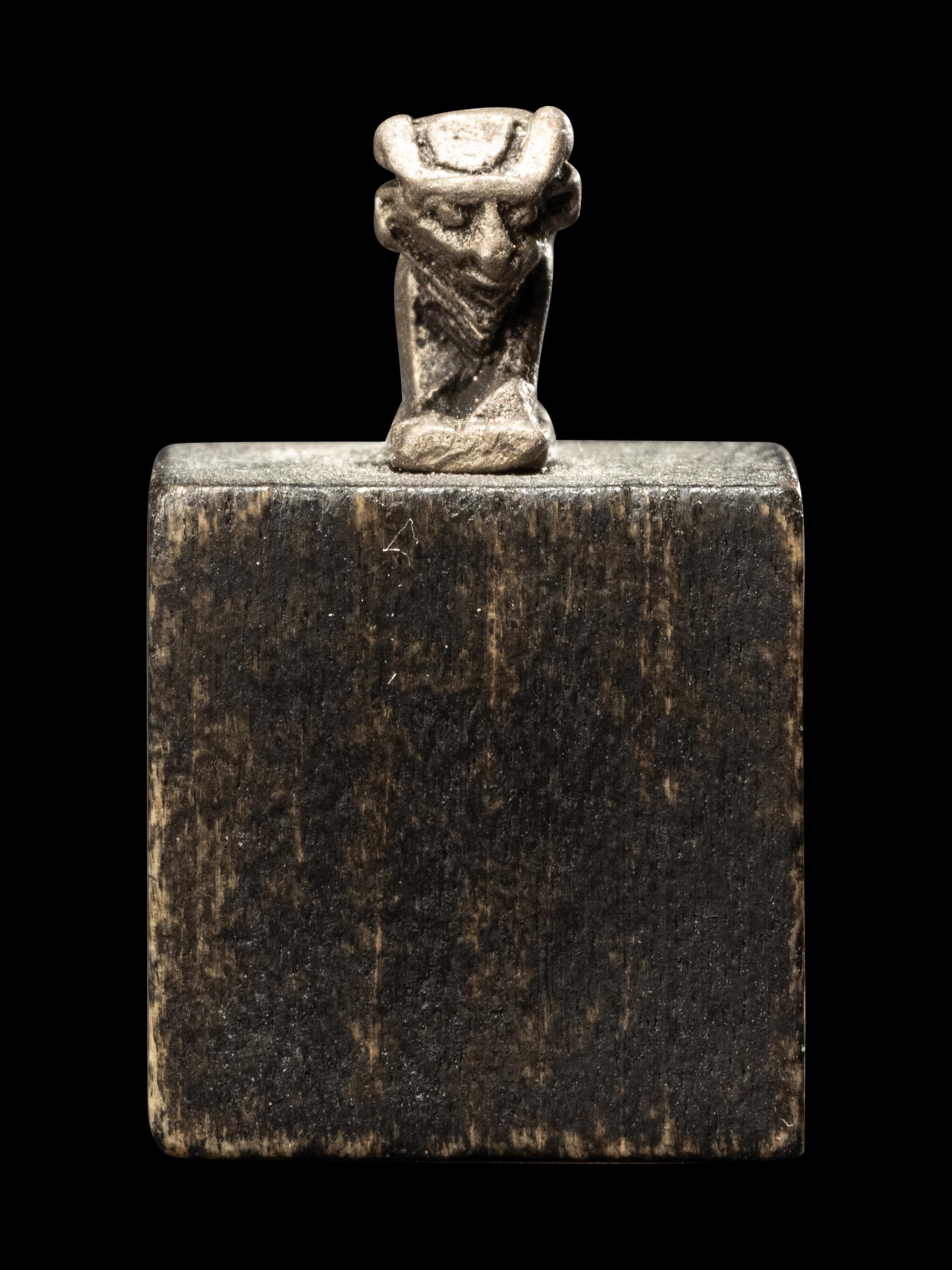 An Egyptian Silver Apis Amulet