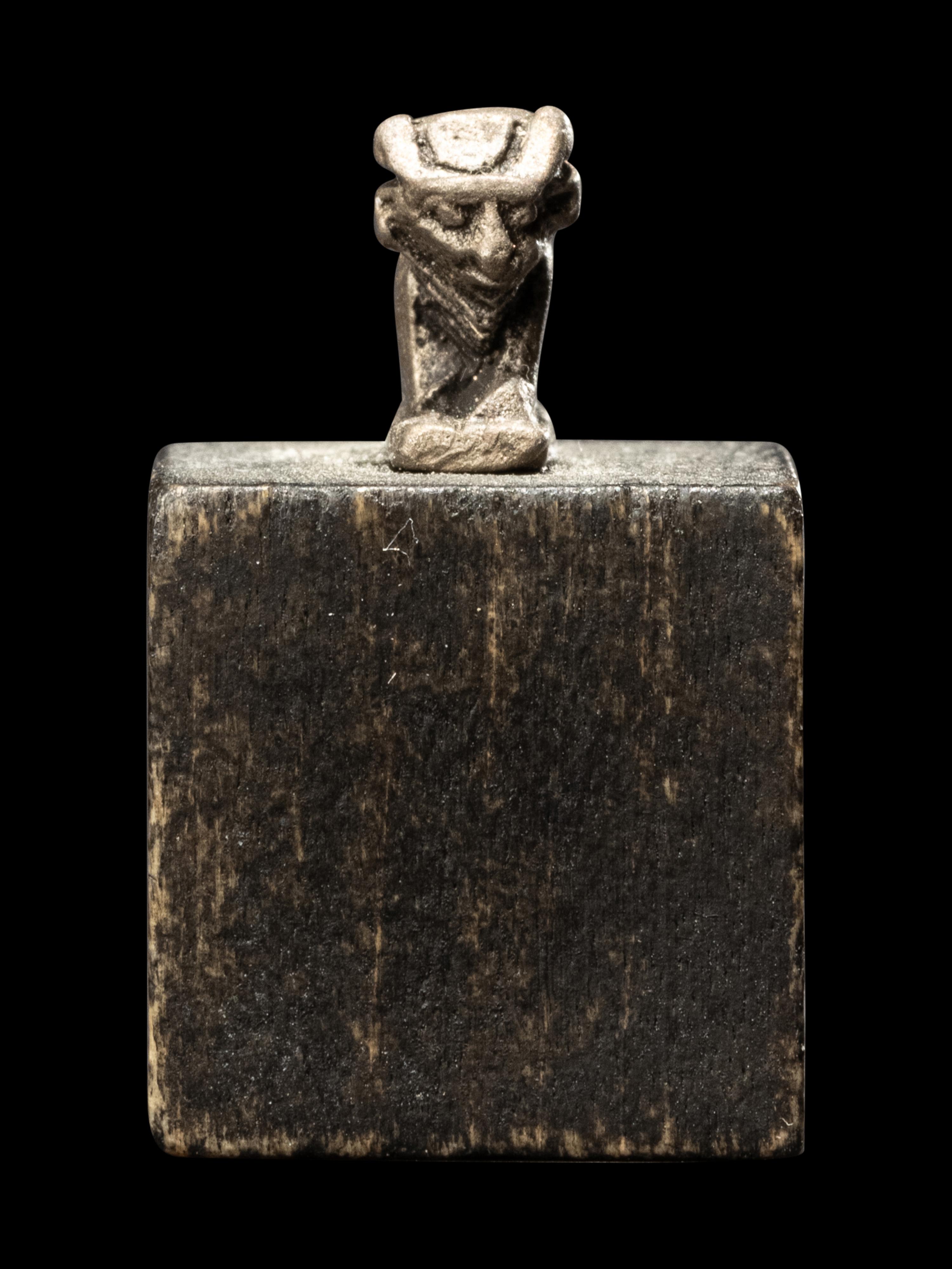 An Egyptian Silver Apis Amulet
