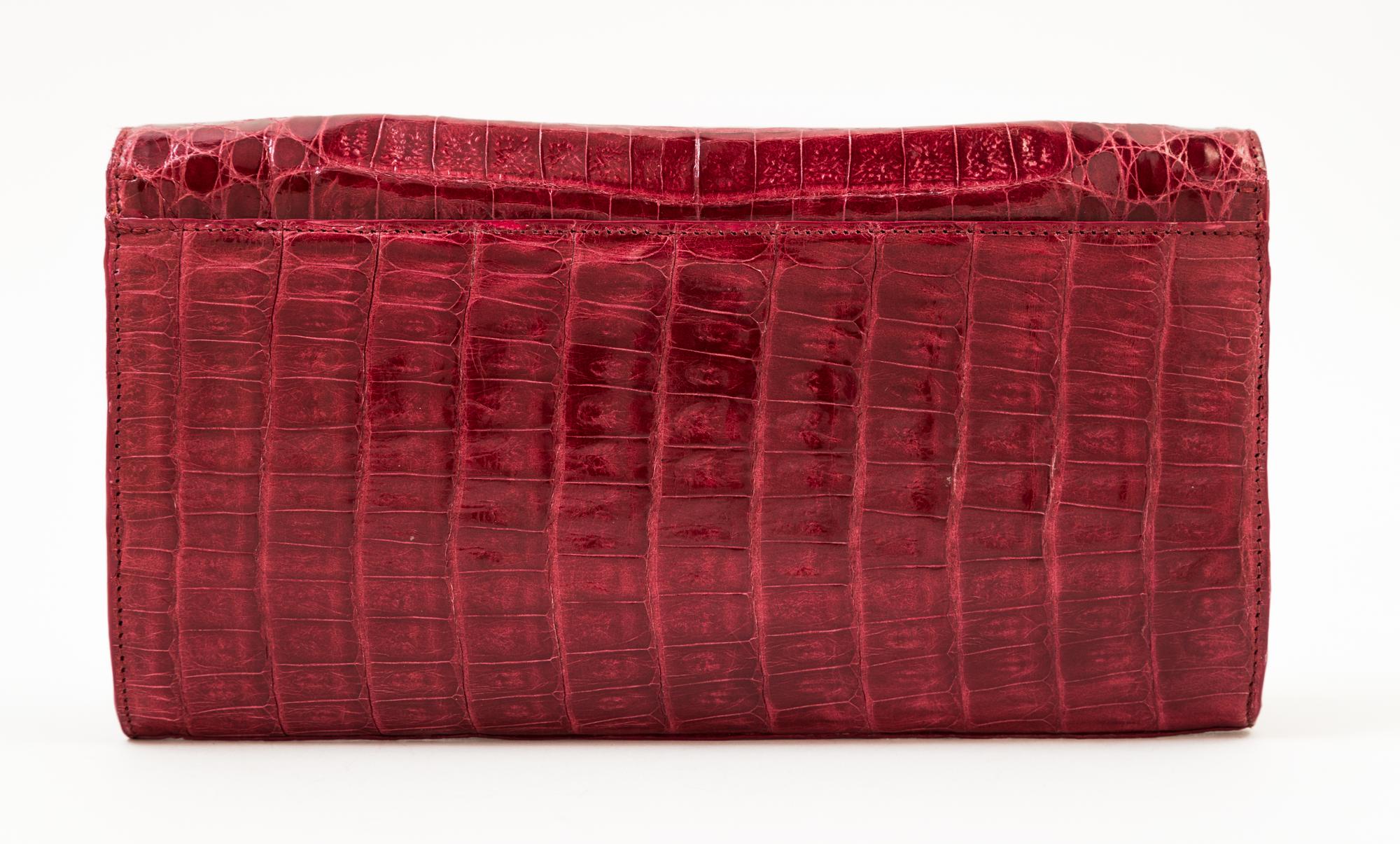 A Nancy Gonzalez Burgundy Columbian Crocodile Clutch, 8.75" x 4.75" x 1.25".
