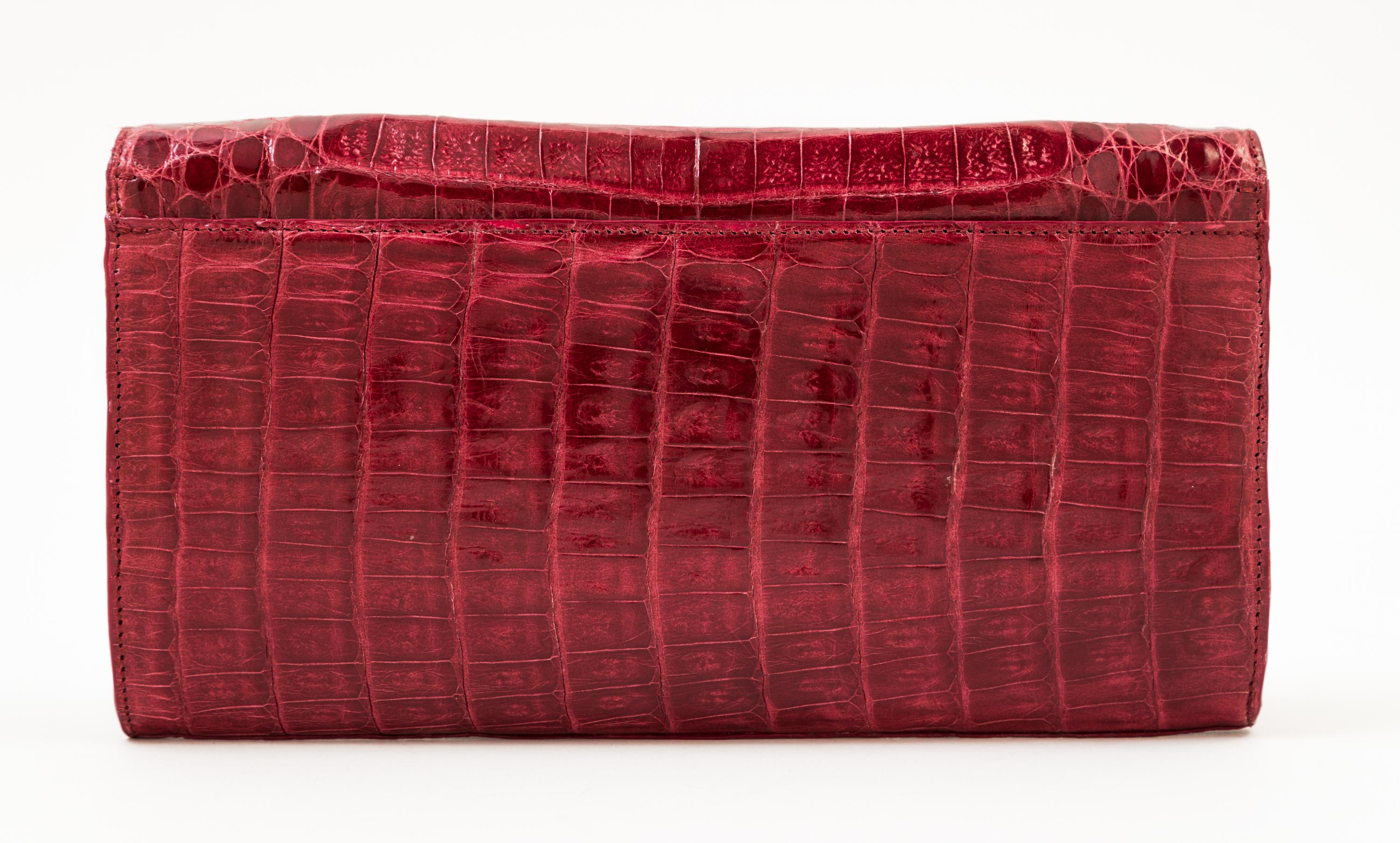 A Nancy Gonzalez Burgundy Columbian Crocodile Clutch, 8.75" x 4.75" x 1.25".