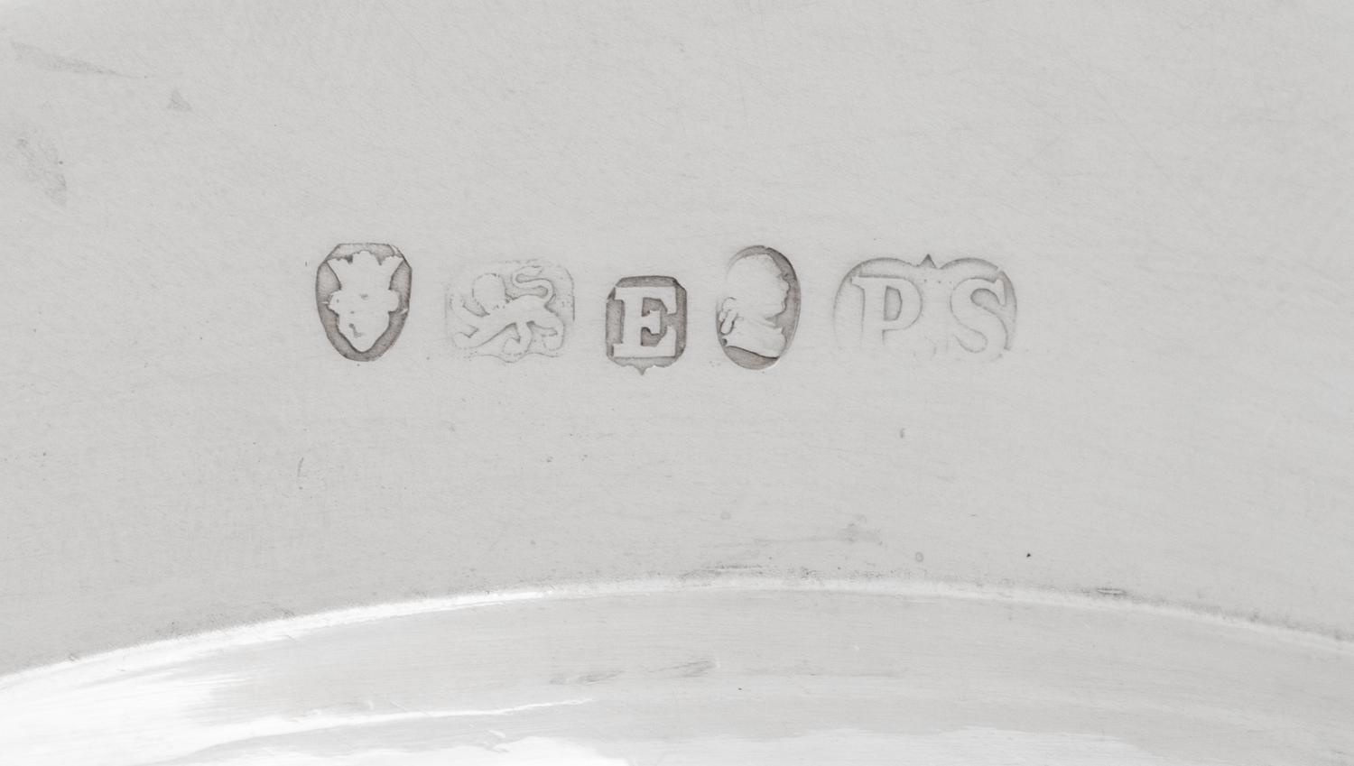 A Set of Twelve Silver Armorial Soup Plates