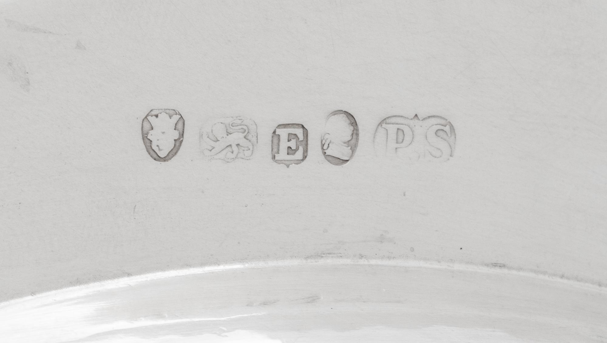 A Set of Twelve Silver Armorial Soup Plates