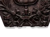 A Carved Oak Coat of Arms