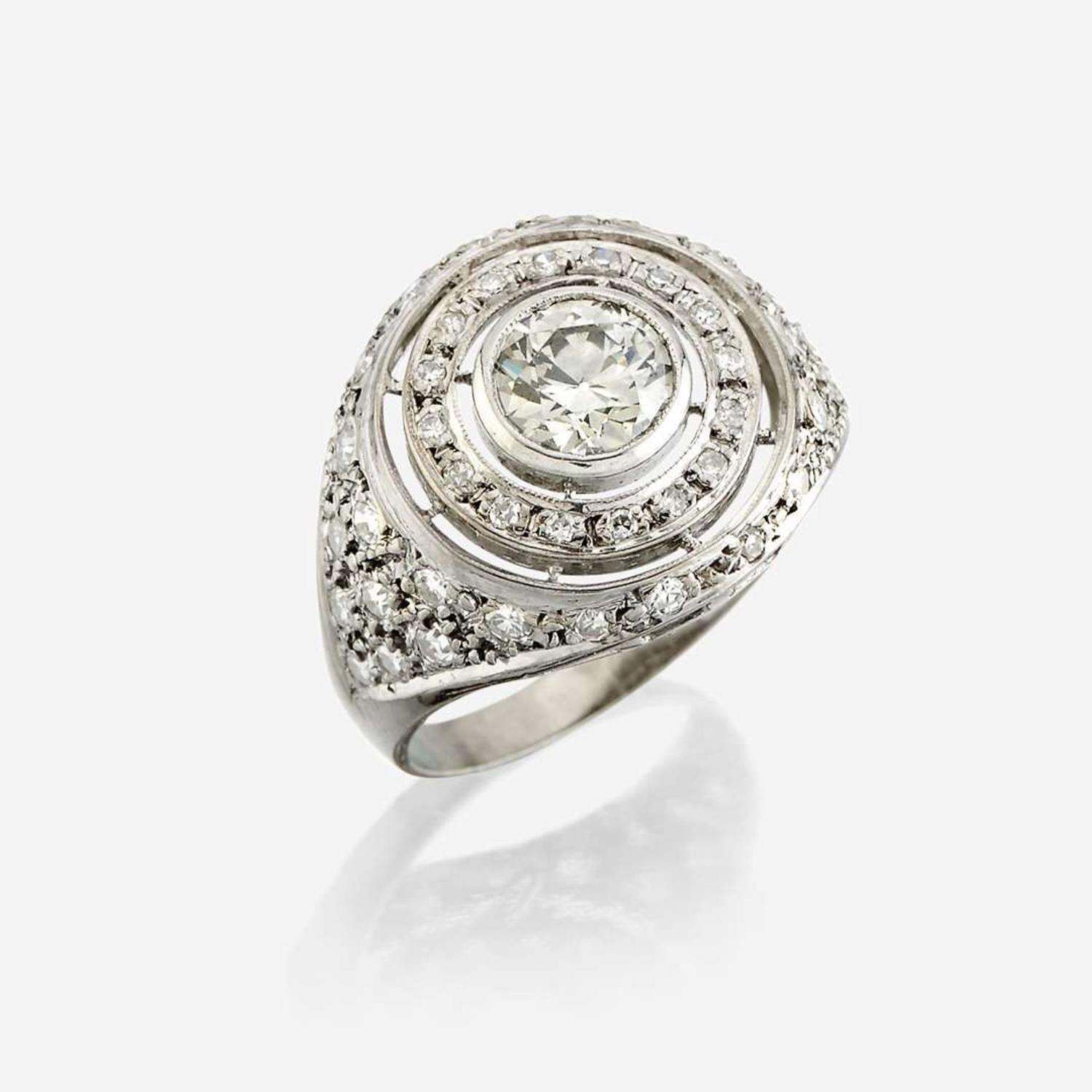 A diamond and eighteen karat white gold ring