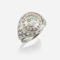 A diamond and eighteen karat white gold ring