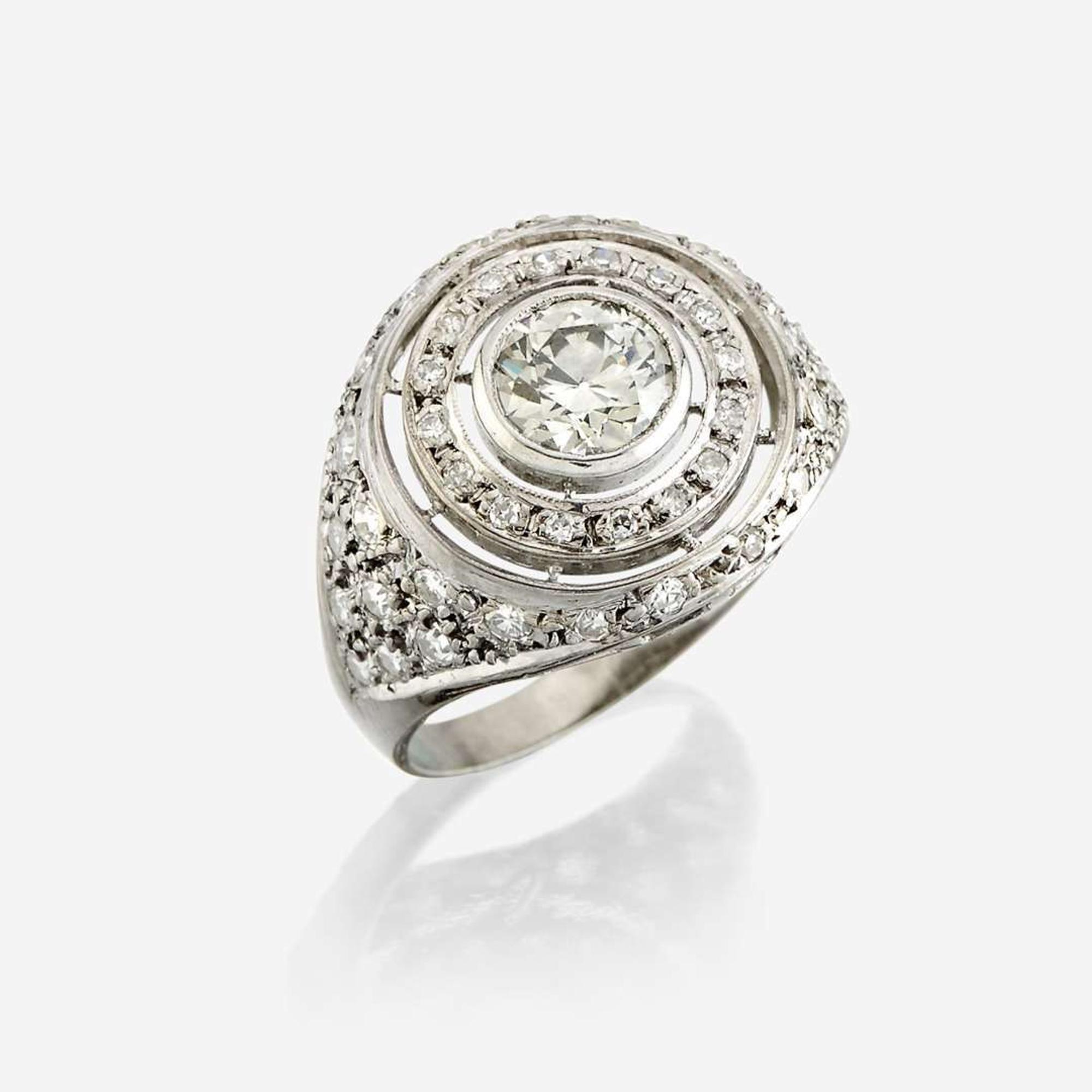 A diamond and eighteen karat white gold ring
