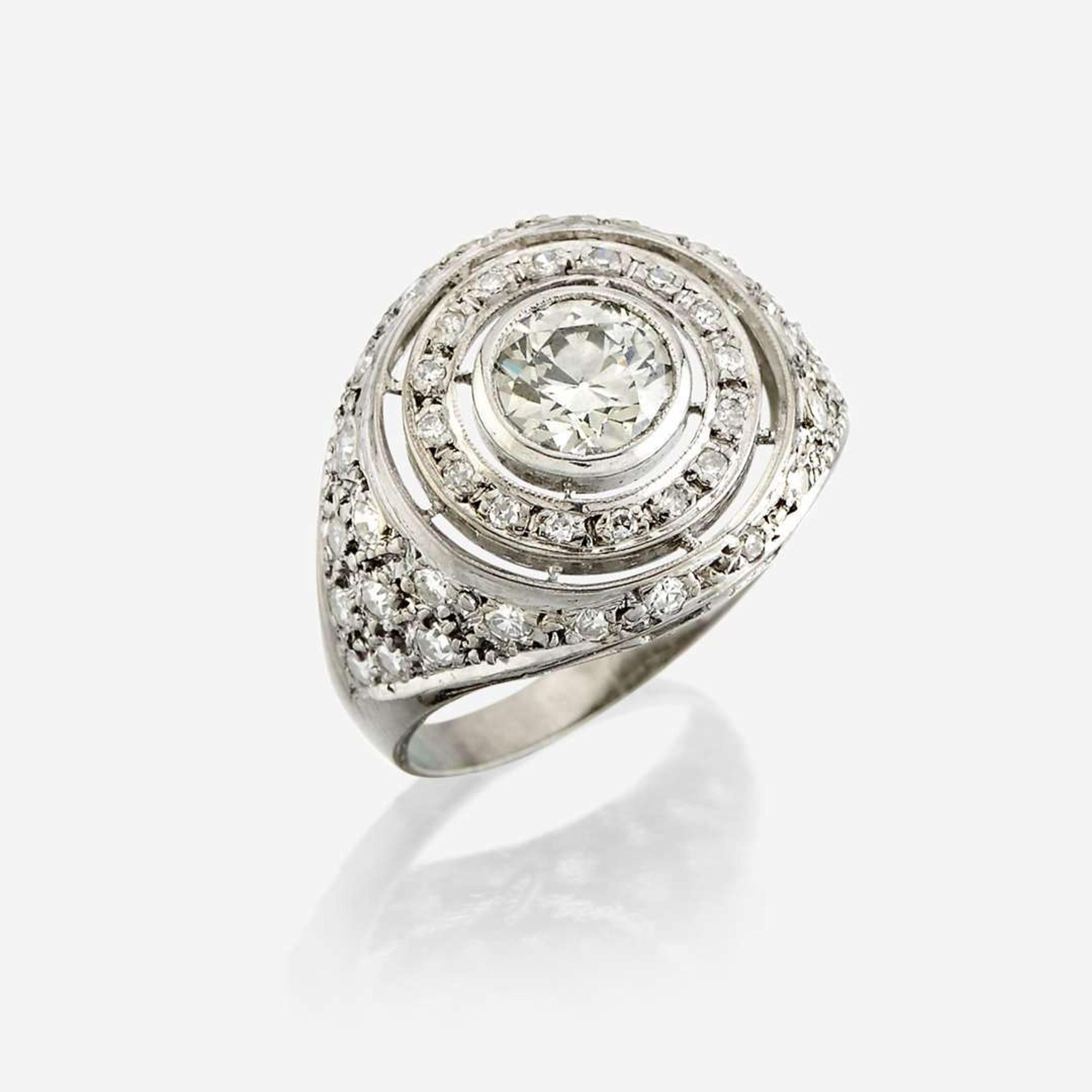 A diamond and eighteen karat white gold ring