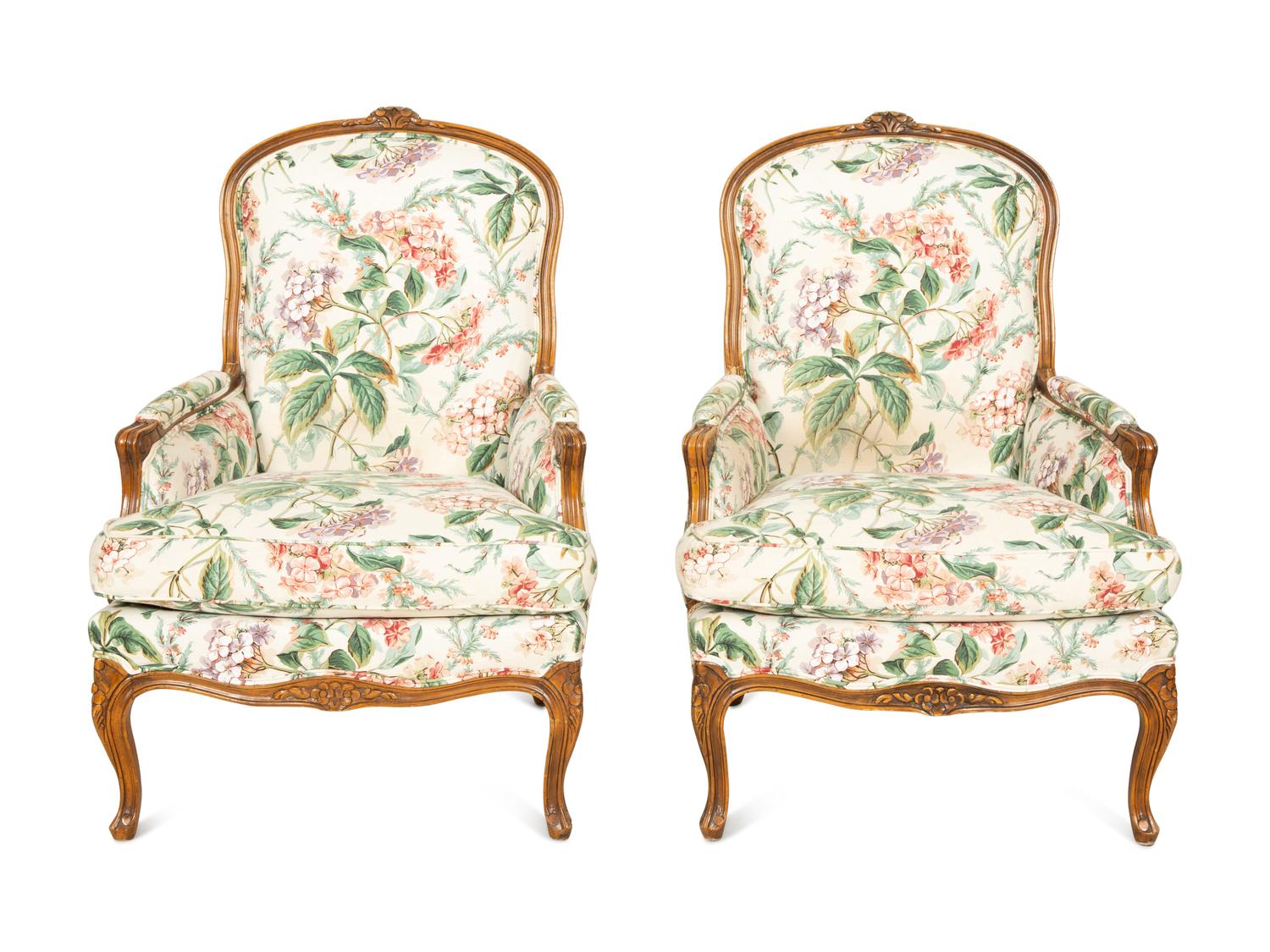 A Pair of Louis XV Style Walnut Bergères