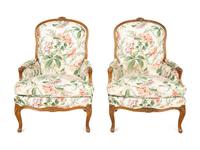 A Pair of Louis XV Style Walnut Bergères