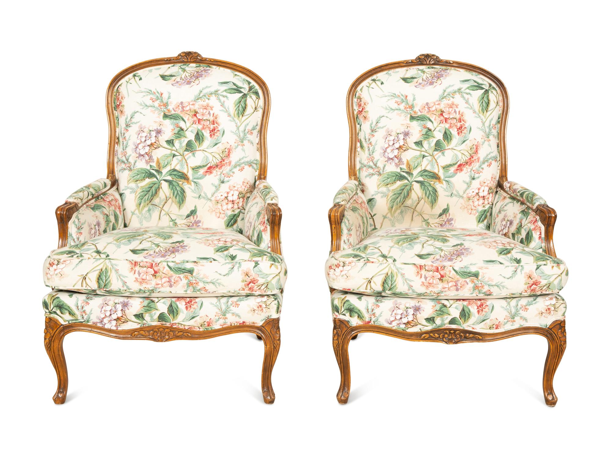 A Pair of Louis XV Style Walnut Bergères