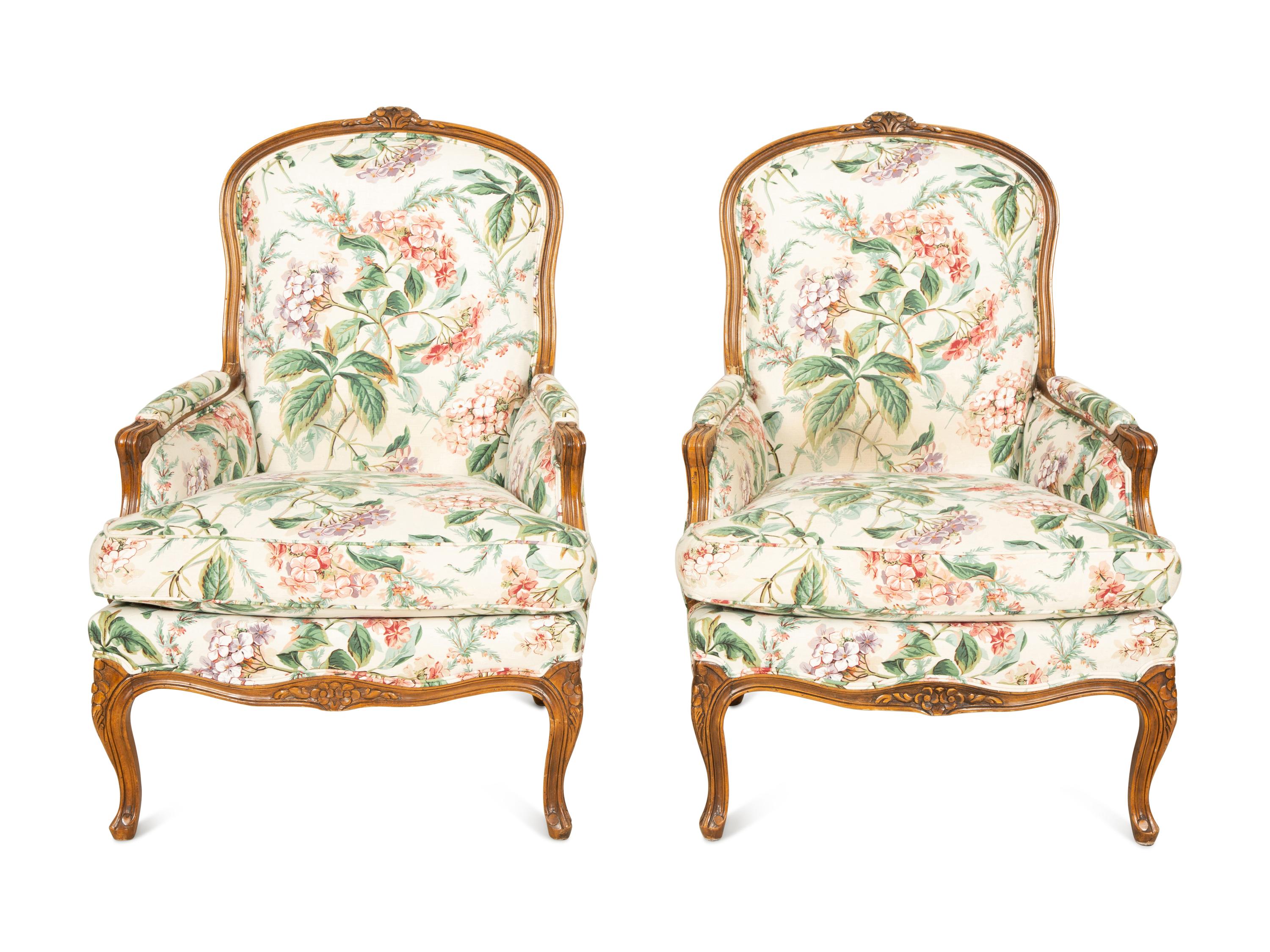 A Pair of Louis XV Style Walnut Bergères