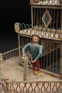 A Painted Sheet Metal and Wire Steamboat Form Birdcage
