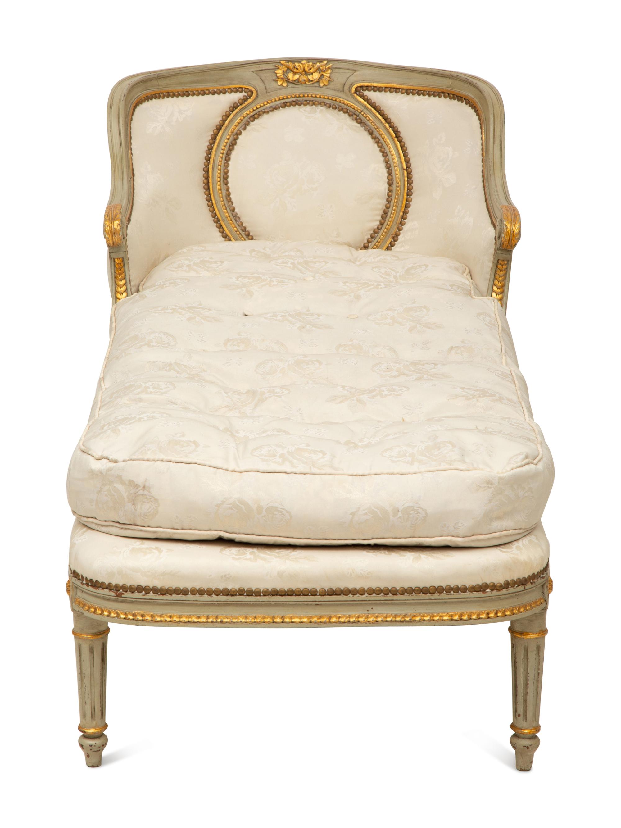 A French Provincial Style Painted and Parcel Gilt Chaise Longue