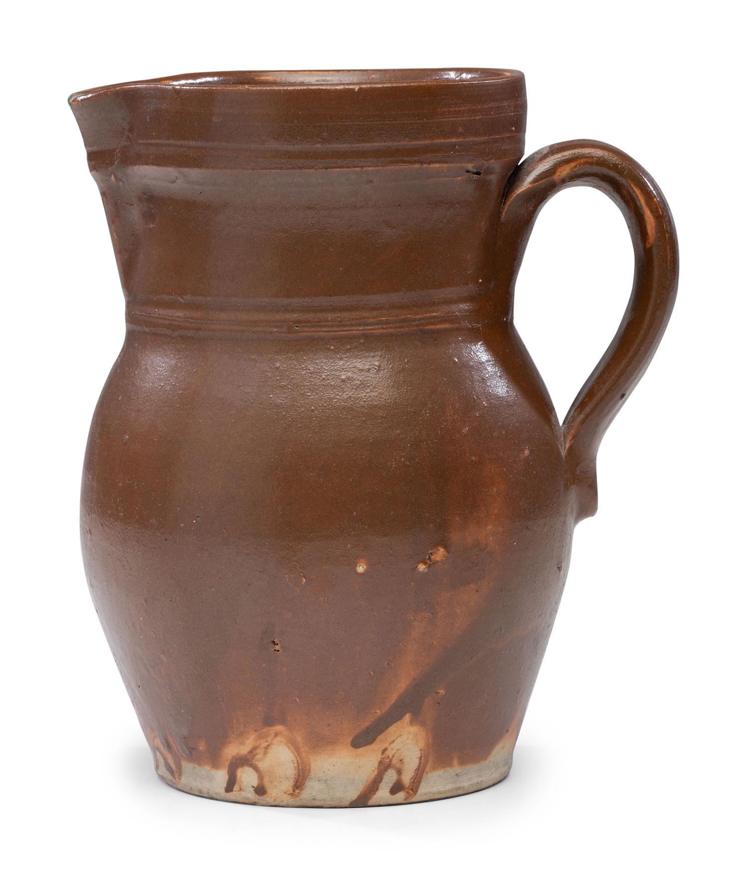 A P.H. Smith Albany Slip Stoneware Pitcher