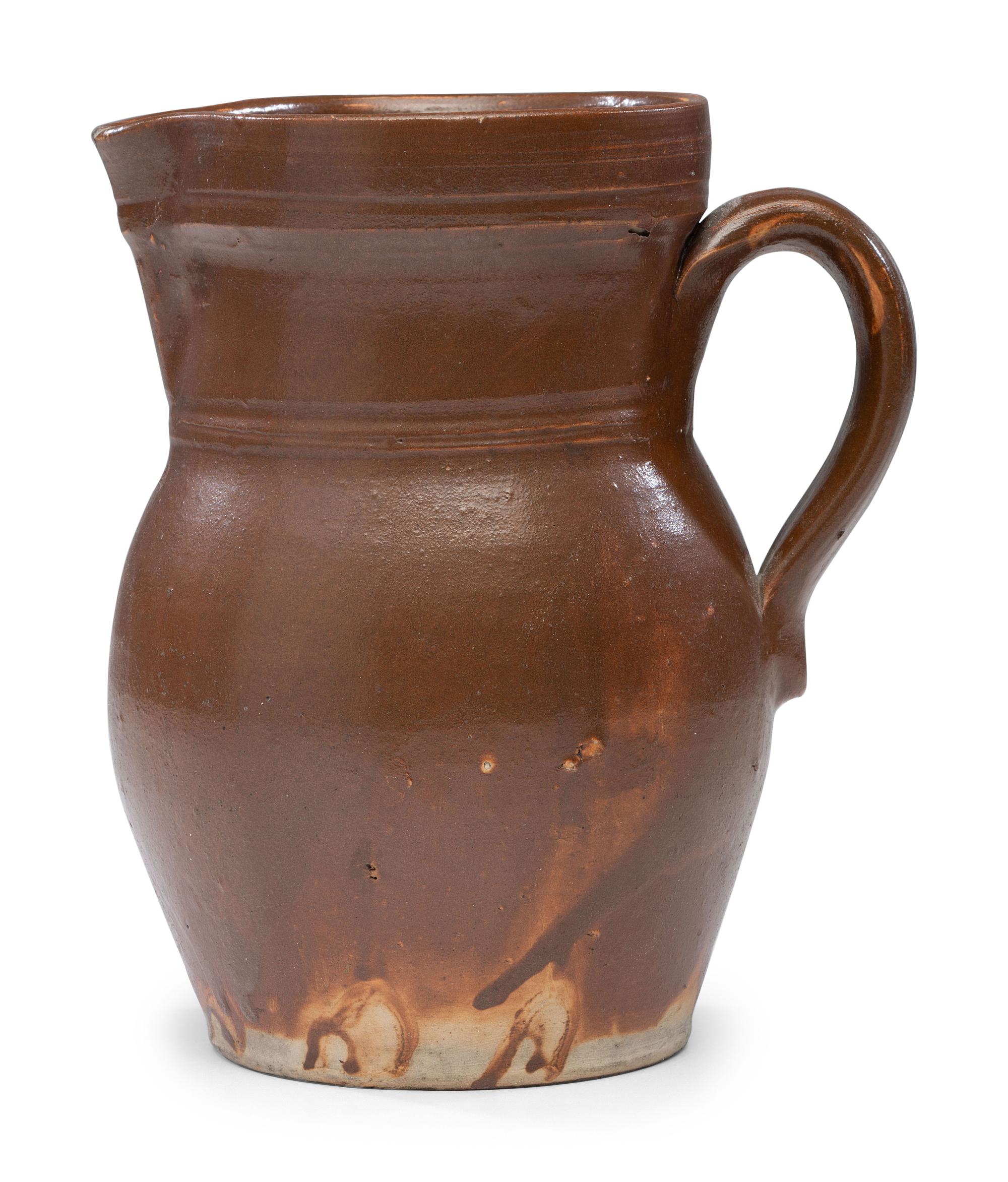 A P.H. Smith Albany Slip Stoneware Pitcher
