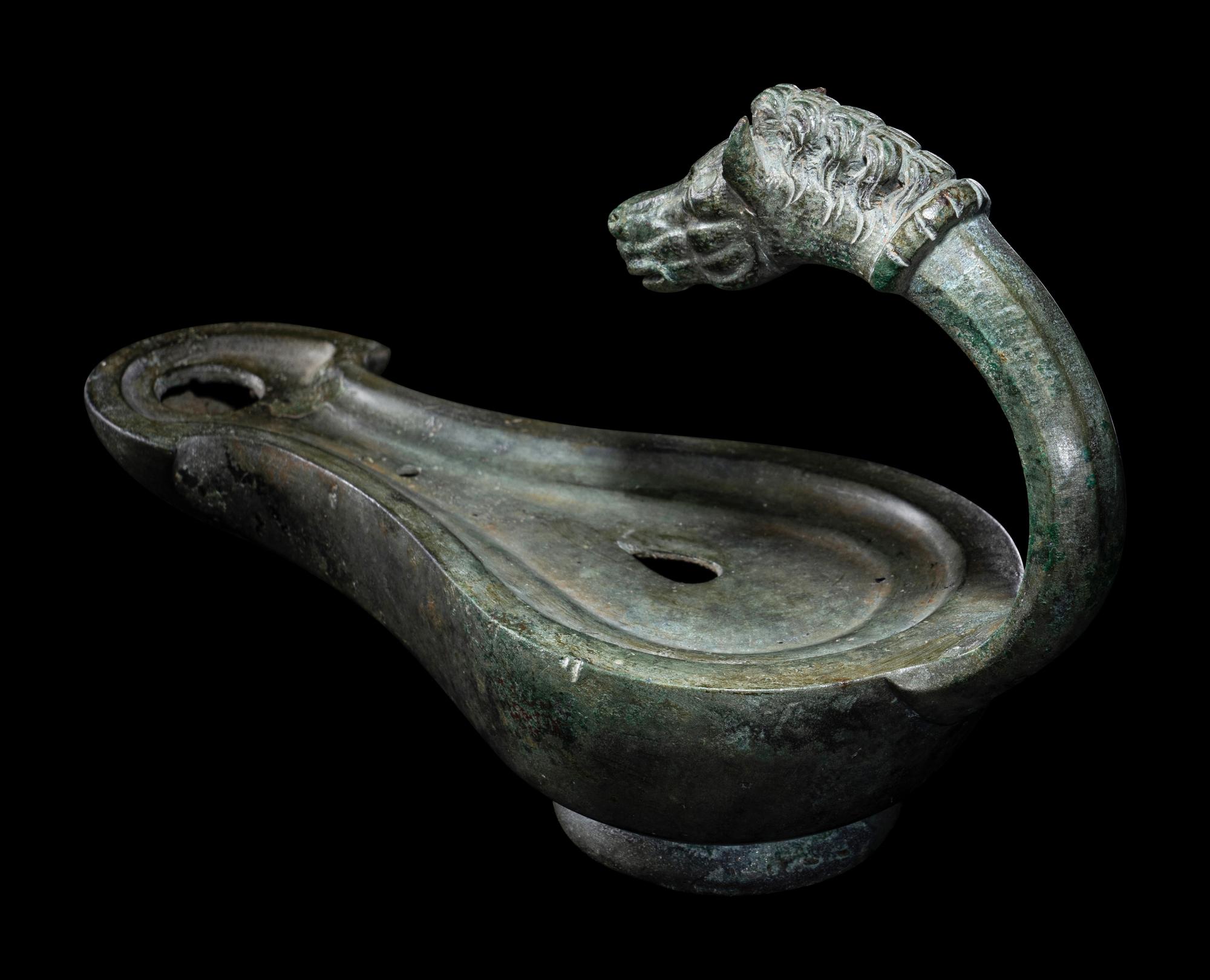 A Roman Bronze Horse Head Oil Lamp